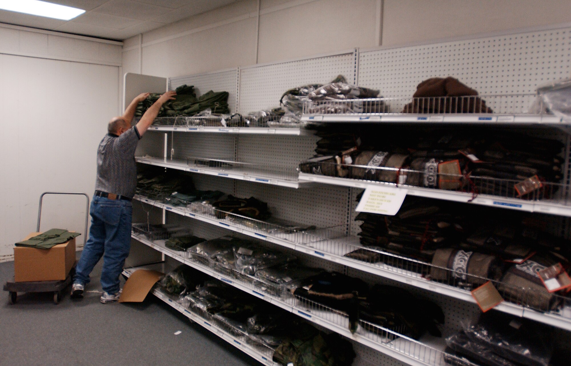 EIELSON AIR FORCE, Alaska--Being blind does not hamper Mr. Mike Nafploitius from doing every aspect of his job including restocking the shelves in the clothing room at the Individual Equipment Issue store at Eielson AFB.  Mr. Nafploitius has been employed at the Individual Equipment Issue store since 2001 helping customers with clothing issue, stocking the clothing room and storing shipments in the stockroom.

(U.S Air Force photo by: Staff Sgt. Eric T. Sheler)
