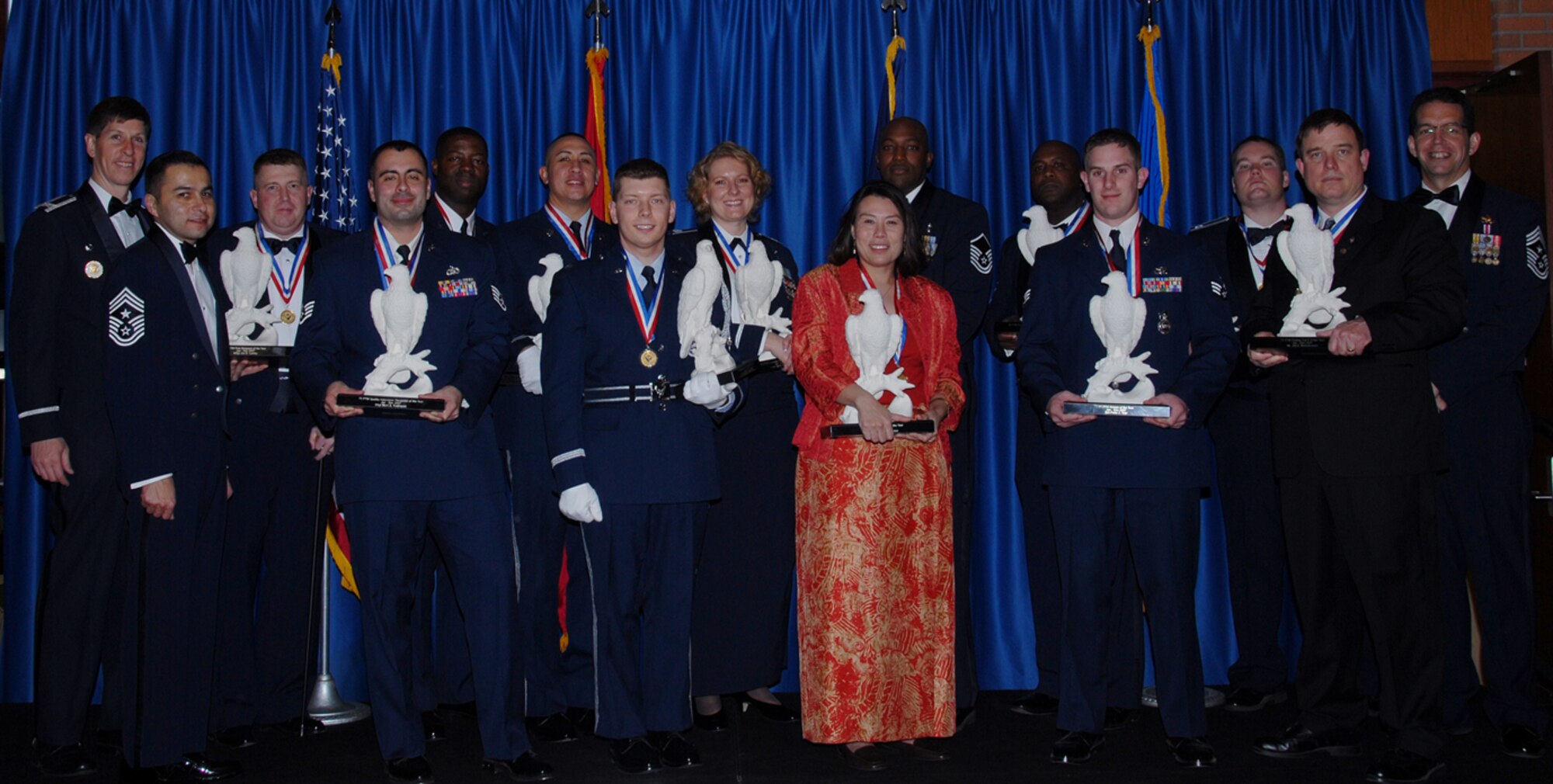 2007 71st Flying Training Wing annual award winners. Pictured from left to right are: Col. Richard Klumpp, Jr., 71 FTW commander; Chief Master Sgt. Ruben Gonzalez, 71 FTW command chief; Master Sgt. Joe Lawley; Staff Sgt. Mark Rodriguez; Tech. Sgt. Derek Cox; Staff Sgt. H. Lei Kaauamo; Capt. Kris Ostrowski; Capt. Jamie Kaauamo; Toshie Whiteaker; Master Sgt. Mitchell Lawrence; Master Sgt. Spencer Parker; Senior Airman Peter Tripi; Capt. Phillip O'Briant; James Malachowski; and Chief Master Sgt. Robert Tappana, 19th Air Force command chief.