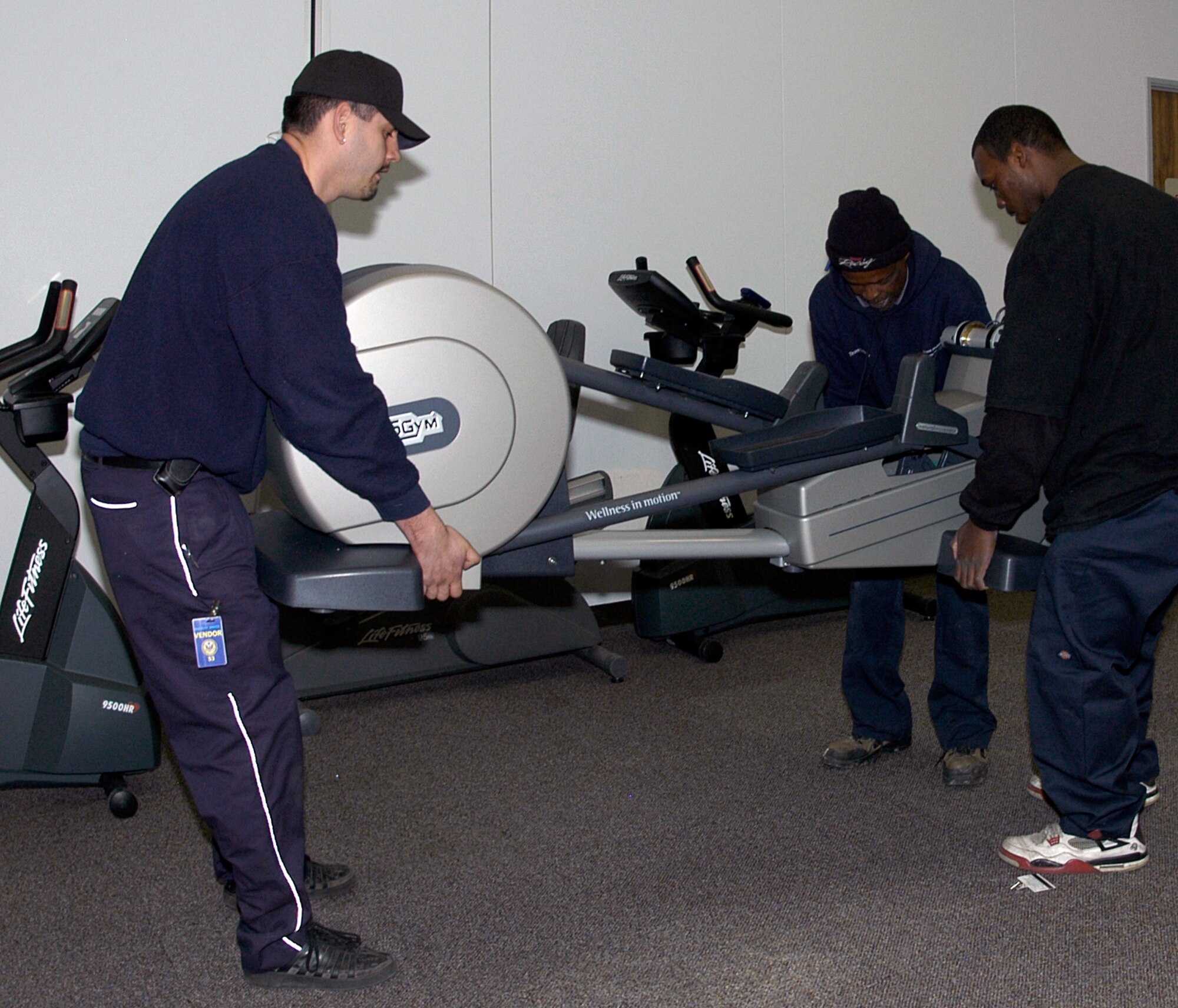 Movers deliver one of six new elliptical machines at the Air Reserve Personnel Center. ARPC opened an expanded 3,700-square foot fitness center that includes more than $50,000 of new exercise equipment. (U.S. Air Force photo/Mike Molina)
