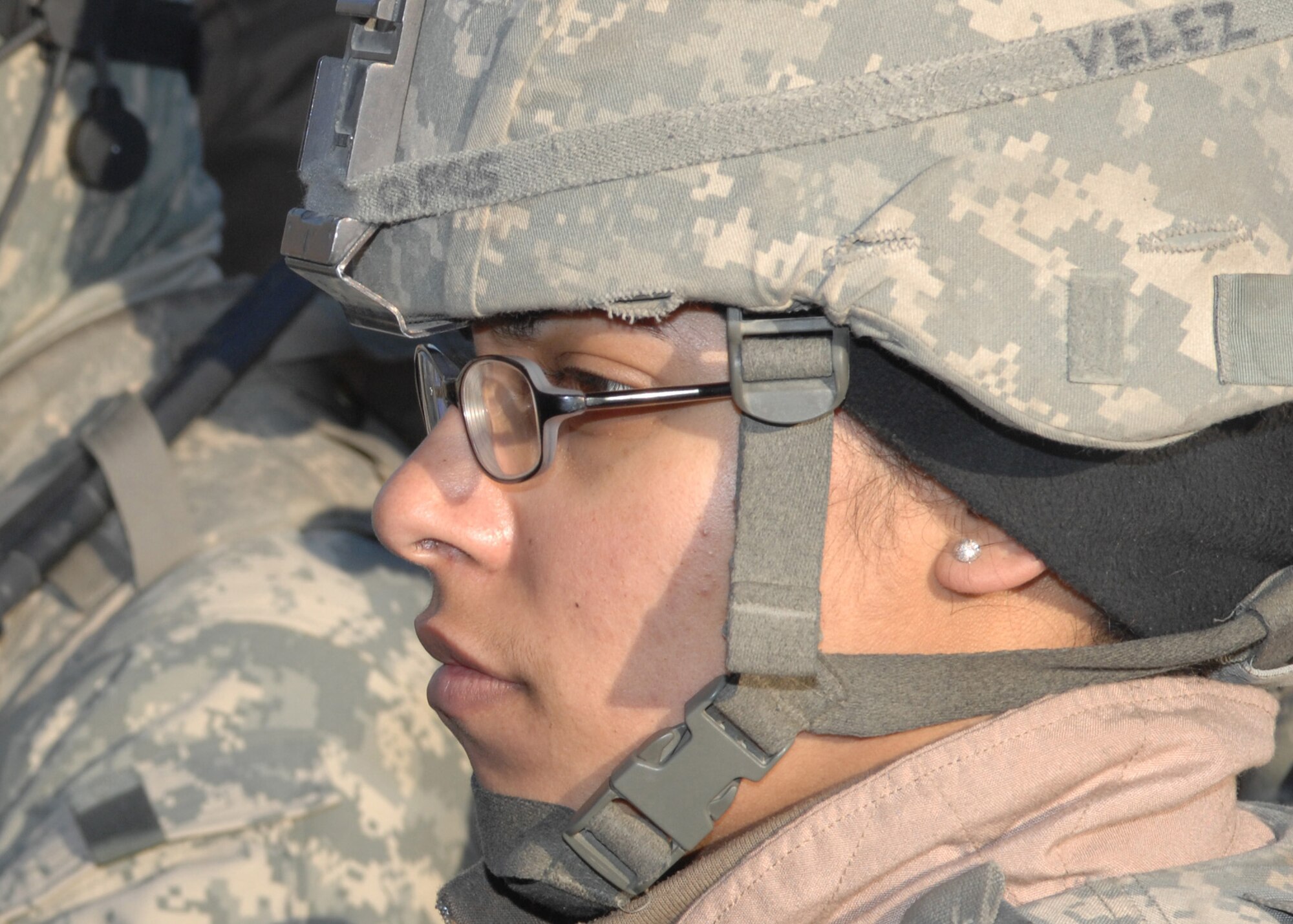 Senior Airman Vanessa Velez listens closely to a briefing just before her next mission outside the wire Feb. 10 at Bagram Air Base, Afghanistan. Airman Velez, who is a vehicle maintenance controller with the 6th Logistics Readiness Squadron at MacDill Air Force Base, Fla., has driven at least 120 convoys during her 365-day deployment in Afghanistan. She is a convoy driver with the Bagram Provincial Reconstruction Team. (U.S. Air Force photo/Master Sgt. Demetrius Lester) 

