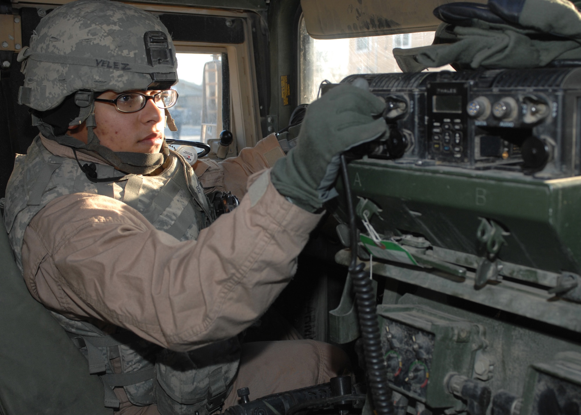 Senior Airman Vanessa Velez prepares her Humvee just before her next mission outside the wire Feb. 10 at Bagram Air Base, Afghanistan. Airman Velez, who is a vehicle maintenance controller with the 6th Logistics Readiness Squadron at MacDill Air Force Base, Fla., has driven at least 120 convoys during her 365-day deployment in Afghanistan. She is a convoy driver with the Bagram Provincial Reconstruction Team. (U.S. Air Force photo/Master Sgt. Demetrius Lester) 