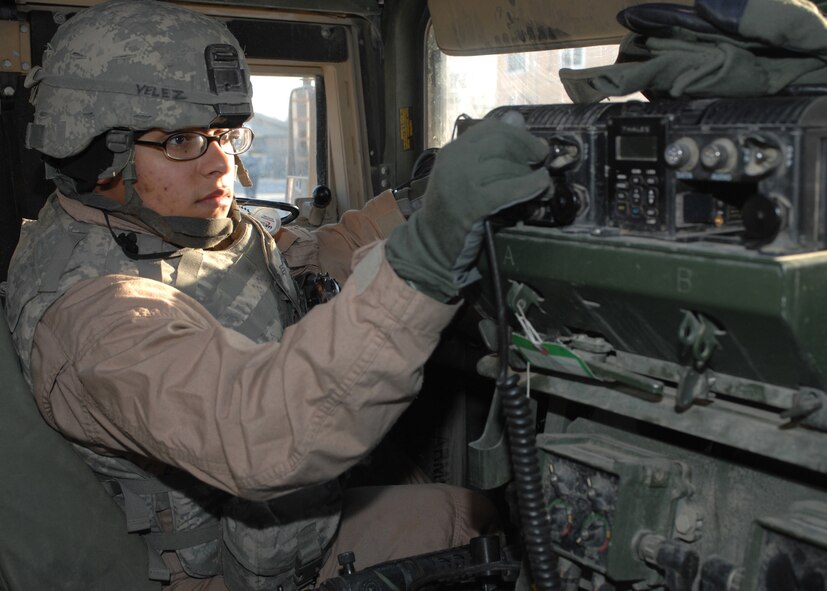 Senior Airman Vanessa Velez prepares her Humvee just before her next mission outside the wire Feb. 10 at Bagram Air Base, Afghanistan. Airman Velez, who is a vehicle maintenance controller with the 6th Logistics Readiness Squadron at MacDill Air Force Base, Fla., has driven at least 120 convoys during her 365-day deployment in Afghanistan. She is a convoy driver with the Bagram Provincial Reconstruction Team. (U.S. Air Force photo/Master Sgt. Demetrius Lester) 