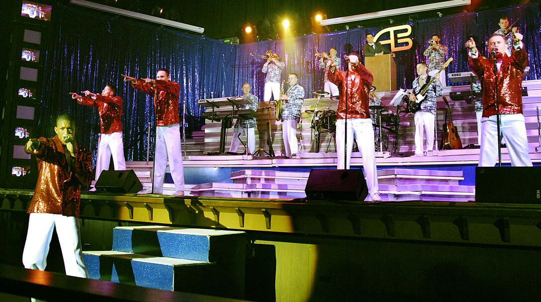 Tops In Blue male vocalist perform Feb. 9 at Memorial Auditorium in Wichita Falls, Texas, during the Air Force's premier entertainment troupe's annual visit. Guests from Sheppard Air Force Base and the surrounding communities were treated with songs from each military era, memorializing the Air Force's 60th Anniversary. (U.S. Air Force photo/Harry Tonemah)