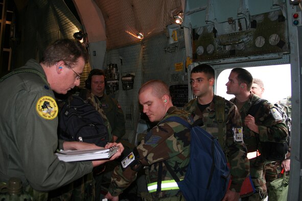 Lt. Col. Brad Goldman, 445th Aeromedical Stagin Squadron, checks each reservists name against a checklist as they board the C-5 on the 445th flight line for the Operational Readiness Inspection at Gulfport Air National Guard Base, Miss., Feb 5, 2008. (U.S. Air Force photo/Mary Allen)
