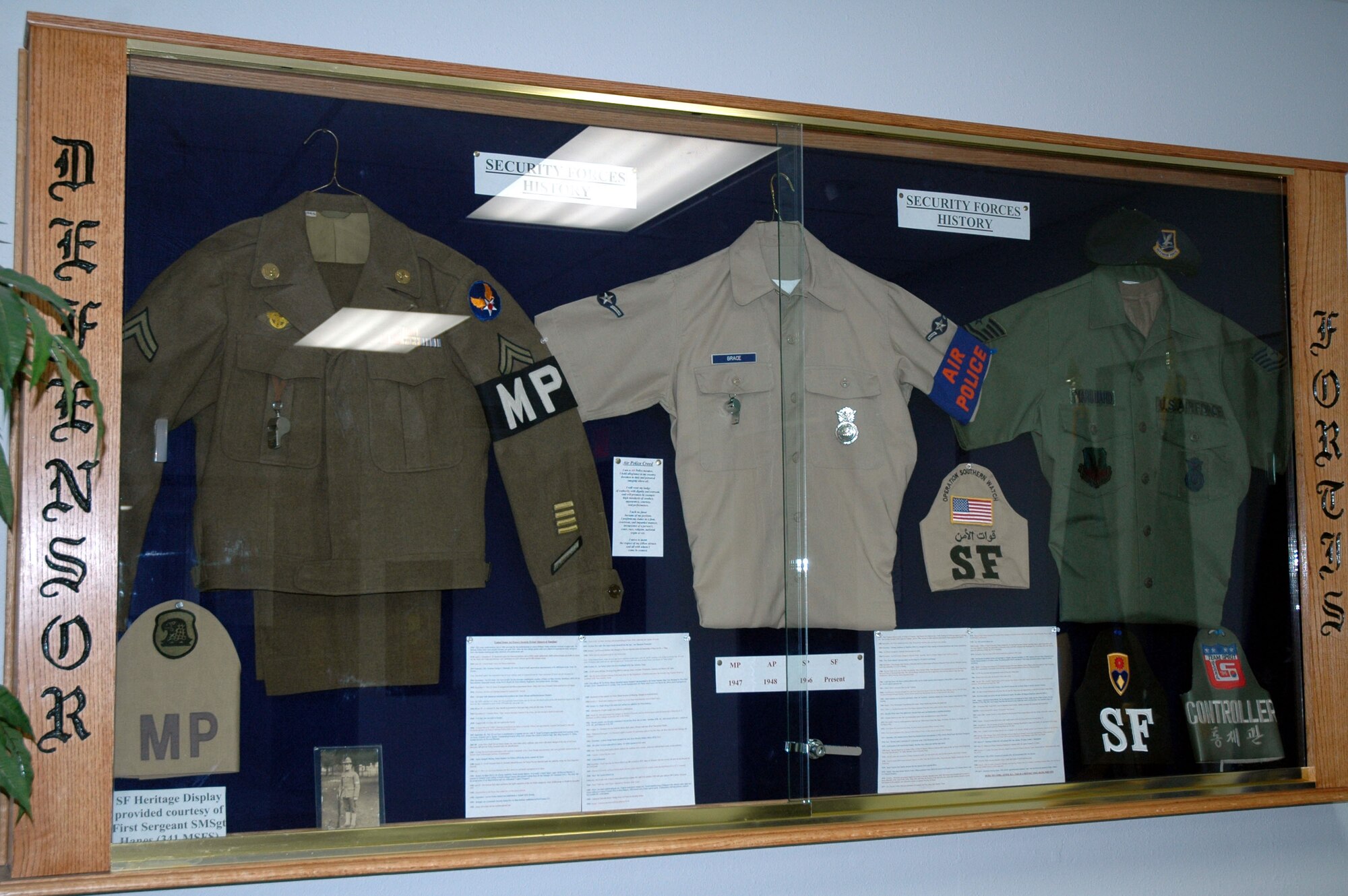 This display case showcases the heritage of the security forces uniforms from the World War II era; the air police uniforms worn 1965 to 1978; and the green fatigues worn throughout the '80s. In an effort to preserve military police history, the 341st Security Forces Group headquarters in building 500 went through a remodel. A vast mural was painted at the entryway; the hallways display posters and images of the past and present; and a uniform display was donated by Chief Master Sgt. Jerry Hanes, 341st Operations Group interim superintendent. (U.S. Air Force photo/Senior Airman Eydie Sakura)