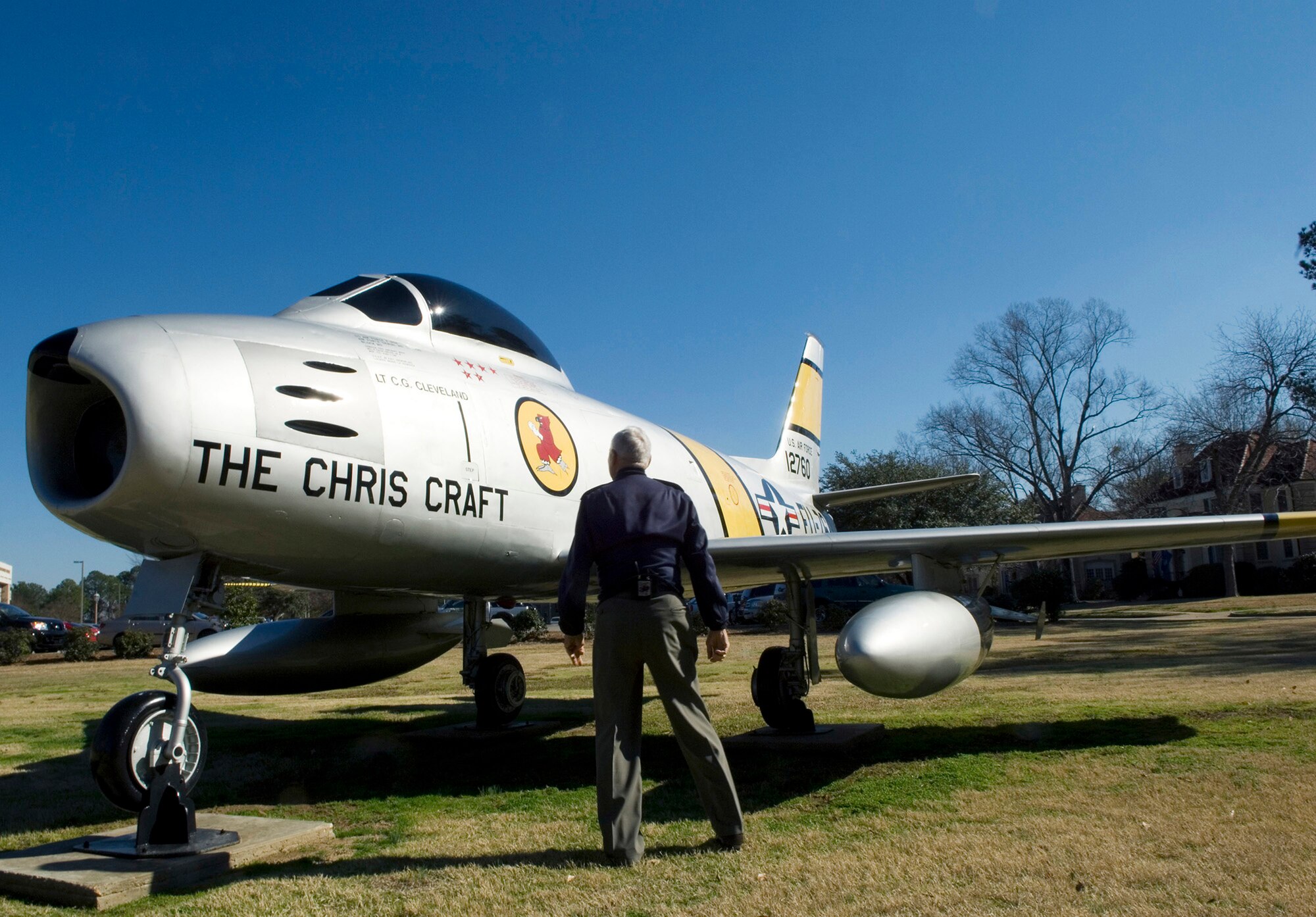 Retired Lt. Gen. Charles G. Cleveland stands before a remake "Chris Craft" F-86A Sabre now a part of the air park at Maxwell Air Force Base, Ala. The "Chris Craft" named after General Cleveland's son, was the aircraft he used to shoot down five MiG-15s during the Korean War. General Cleveland was deployed to South Korea in March 1952, where he flew F-86s as a flight commander with the 4th Fighter Interceptor Wing at Kimpo Air Base. (U.S. Air Force photo/Staff Sgt. Bennie J. Davis III)