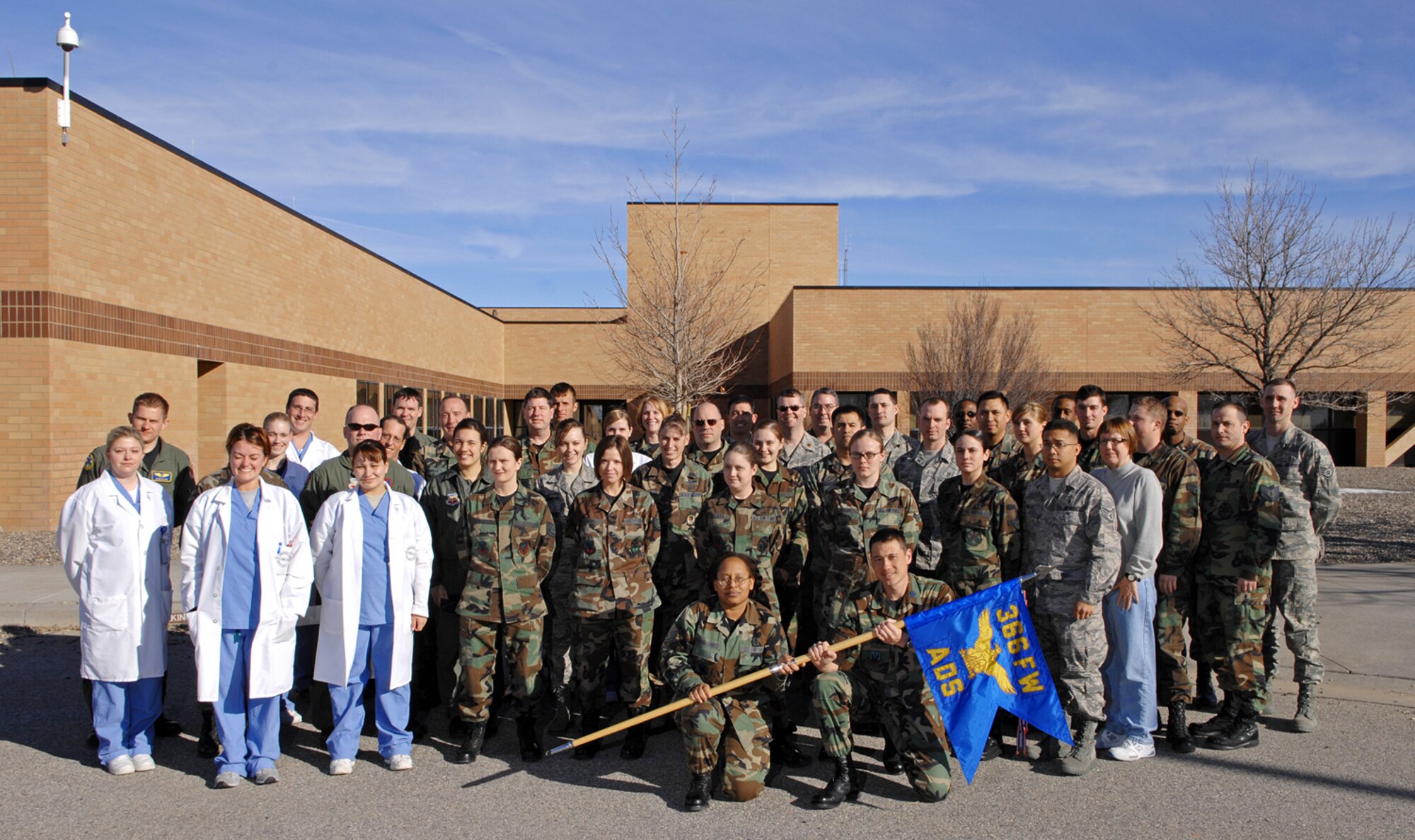 MOUNTAIN HOME AIR FORCE BASE, Idaho -- Members of the 366th Aeromedical Dental Squadron pose for a picture in front of the dental clinic here Feb. 12. Recently, the 366th ADS was named Team Aerospace of the Year at Air Force level while Capt. Warren Conrow, 366th Medical Group laboratory flight commander, was honored as the Air Force’s top Laboratory Manager of the Year. (U.S. Air Force photo/ Airman 1st Class Ryan Crane)