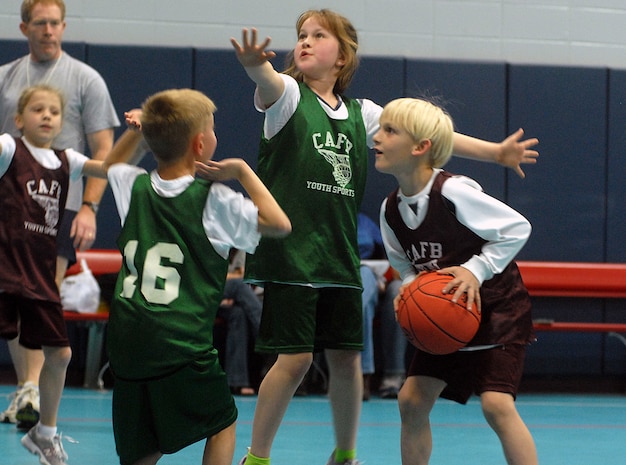 Vincent Tascione, 7, of the Charleston Jaguars, son of Tech. Sgt. Peter Tascione, lines up a shot before making a basket at the Charleston AFB Youth Center Saturday. (U.S. Air Force photo/Master Sgt. Paul Kilgallon)