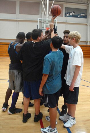 The Charleston AFB Mavericks basketball team joins together for a final team chant during practice Feb. 8 at the Charleston AFB Fitness and Sports Center.  The team is comprised of children of Airmen from Charleston AFB and students from River Oaks Middle School. (U.S. Air Force photo/Staff Sgt. Jennifer Arredondo)