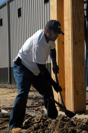 Staff Sgt. Howard Goins, 437th Logistics Readiness Squadron, prepares to swing a pick axe Feb. 8 at the Top 3-sponsored Habitat for Humanity project in Summerville, S.C. (U.S. Air Force photo/Master Sgt. Paul Kilgallon)