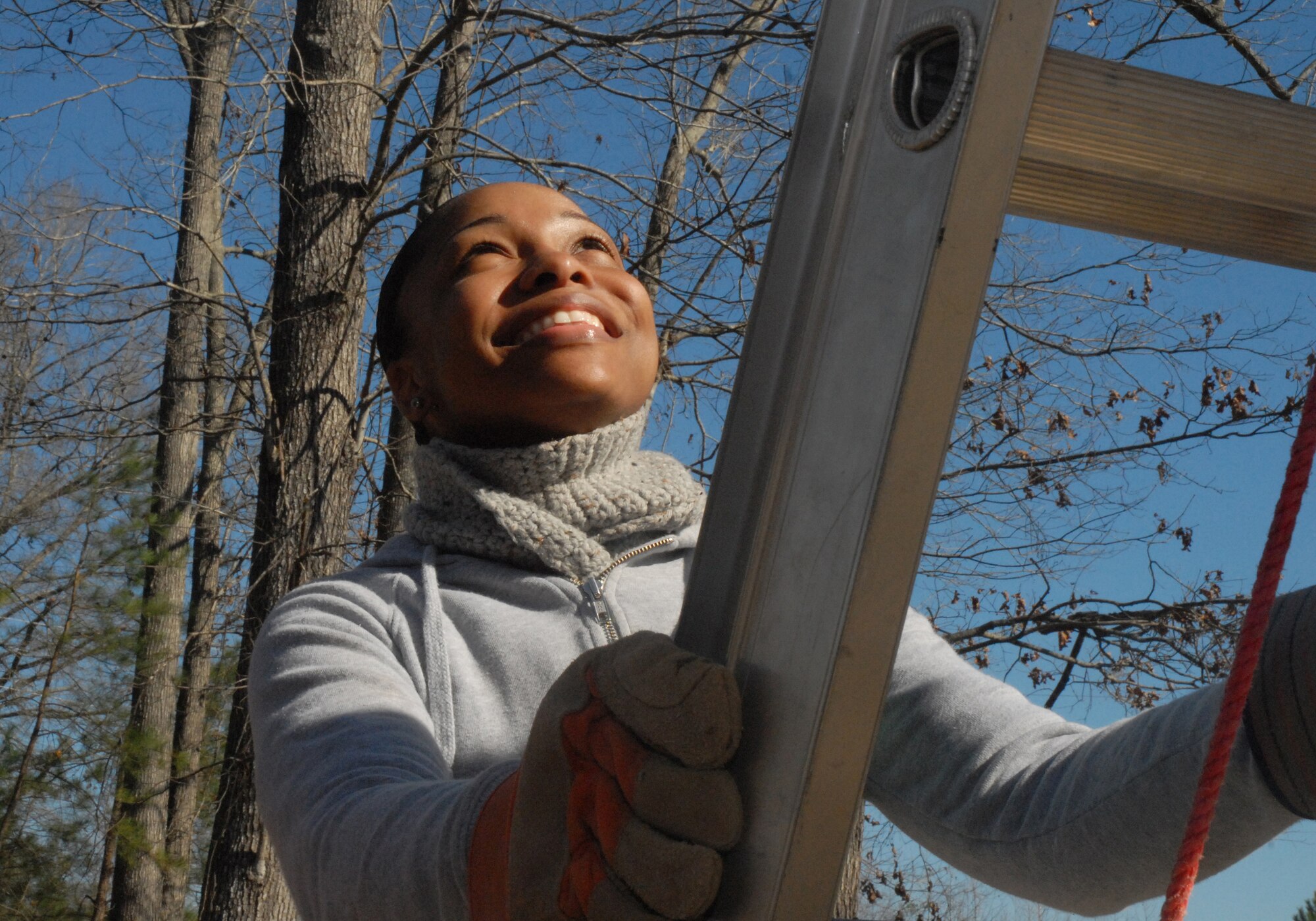 Airman 1st Class Zina Wright, 437th Logistics Readiness Squadron, looks upward before making her climb to the roof at the Top 3-sponsored Habitat for Humanity project in Summerville, S.C. (U.S. Air Force photo/Master Sgt. Paul Kilgallon)