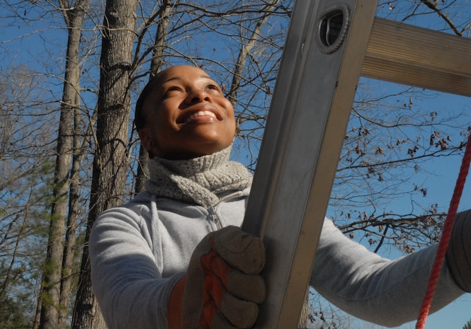 Airman 1st Class Zina Wright, 437th Logistics Readiness Squadron, looks upward before making her climb to the roof at the Top 3-sponsored Habitat for Humanity project in Summerville, S.C. (U.S. Air Force photo/Master Sgt. Paul Kilgallon)