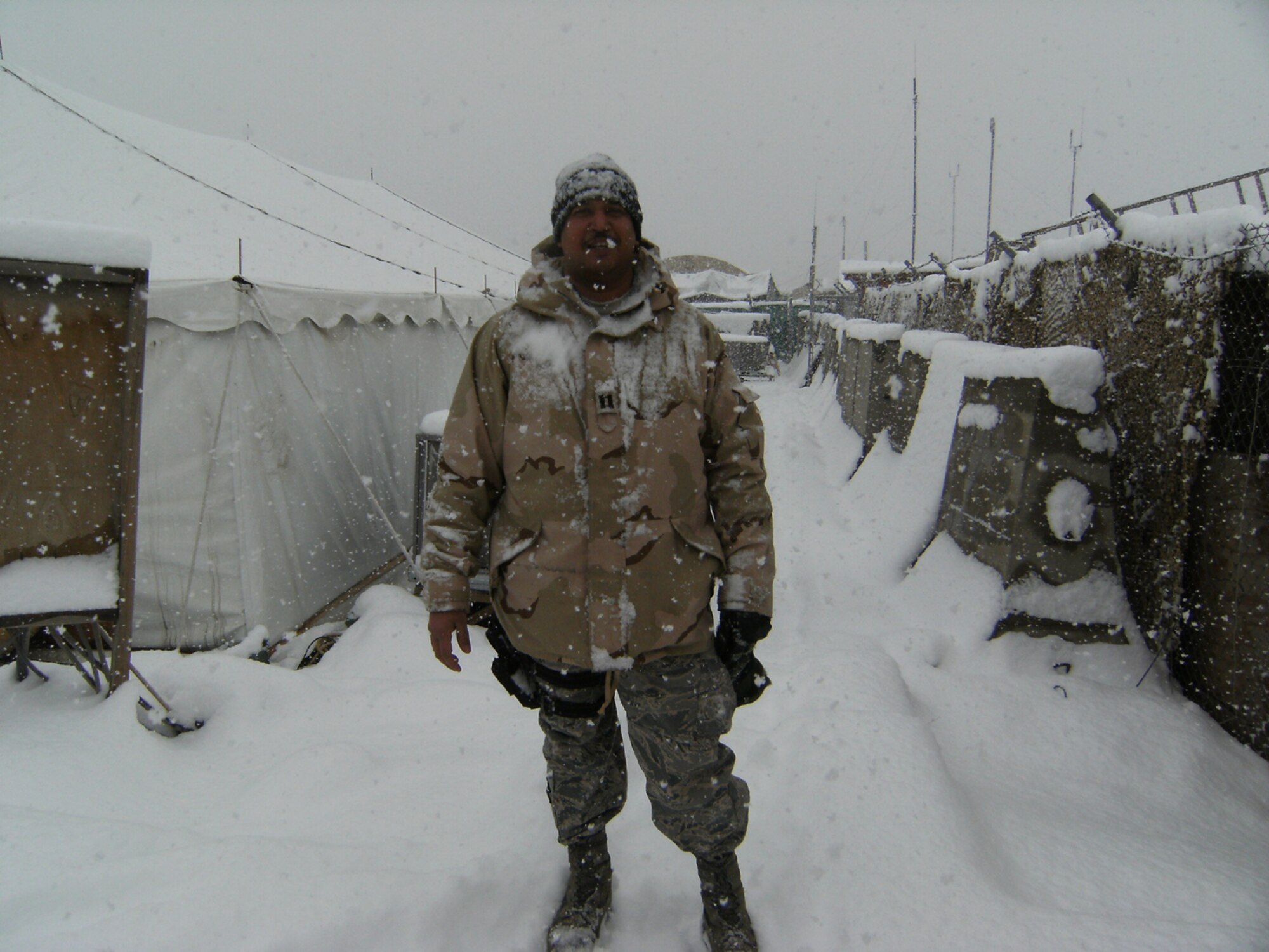 SEYMOUR JOHNSON AIR FORCE BASE, N.C. -- As North Carolina prepares for a little snow today, Capt. Neil Chandler of the 916th Logistics Readiness Squadron stands in a pile of it in Afghanistan. Capt. Chandler, a reservist here at Seymour Johnson, deployed in early January.