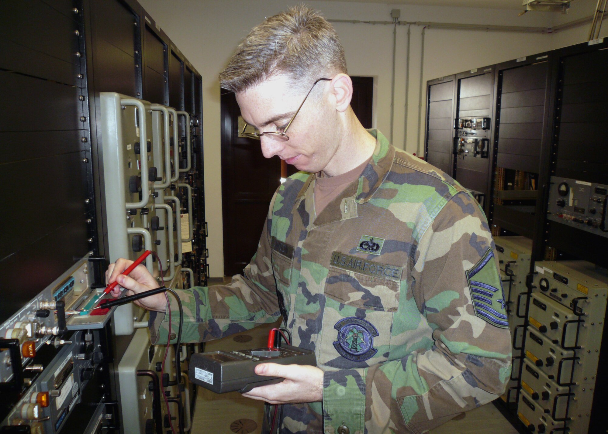 SPANGDAHLEM AIR BASE, Germany – Master Sgt. Jeff Dawson, 52nd Communications Squadron, checks the voltage on an air traffic control radio. Sergeant Dawson is the section chief of the air traffic control and landing systems shop. (U.S. Air Force photo/Airman 1st Class Steven McKee)