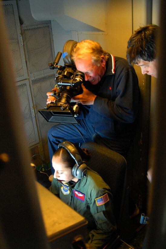Eric Saarinen, a director and cameraman filming a new round of Air Force commercials, films over the shoulder of Staff Sgt. Lucero Stockett, a KC-10 Extender boom operator from Travis Air Force Base, Calif., as she performs an aeriel refueling of an Edwards AFB, Calif., F-22 Raptor on Feb. 7. Camera crews were at Edwards Feb. 6 to 8 filming one of three new Air Force commercials. The two other commercials will feature the newly created Air Force Cyber Command and Air Force Space Command. (Air Force Photo by Master Sgt. Eric M. Grill)