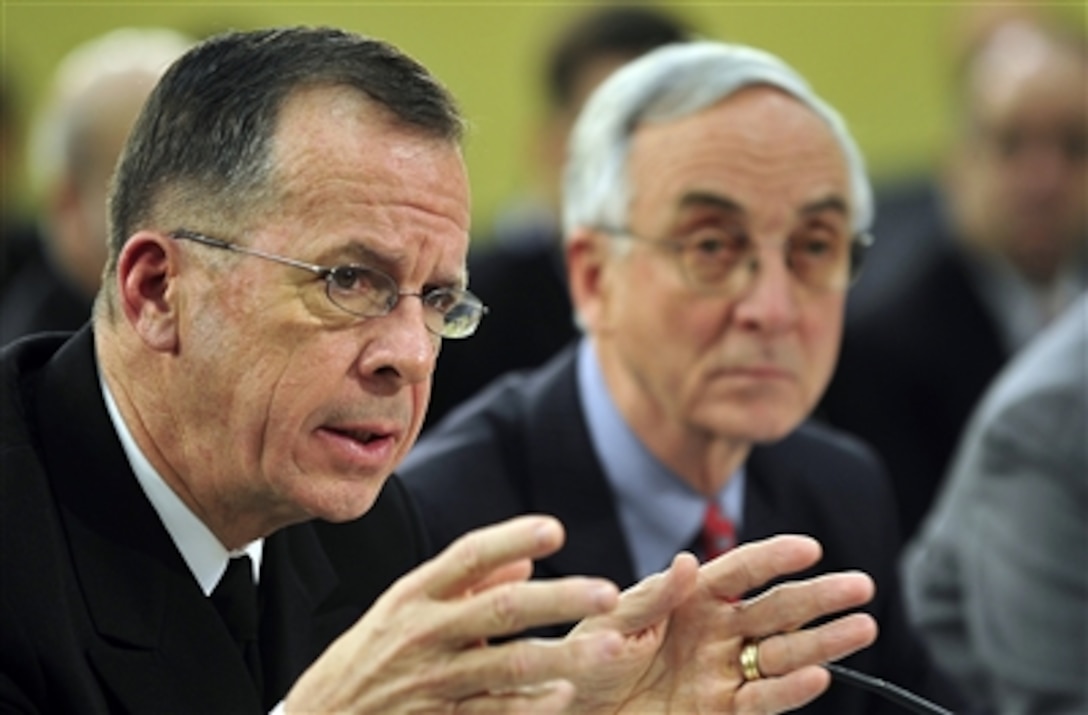 Chairman of the Joint Chiefs of Staff Adm. Mike Mullen responds to a question during a House Appropriations Committee hearing with Deputy Secretary of Defense Gordon England and Under Secretary of Defense (Comptroller) and Chief Financial Officer Tina Jonas at the Rayburn office building in Washington, D.C., on Feb. 13, 2008.  