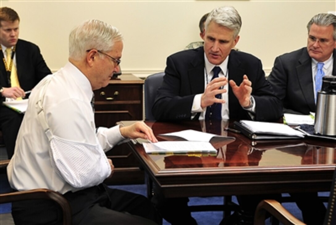 Secretary of Defense Robert Gates back at work today after slipping on some ice and fracturing his right shoulder.  