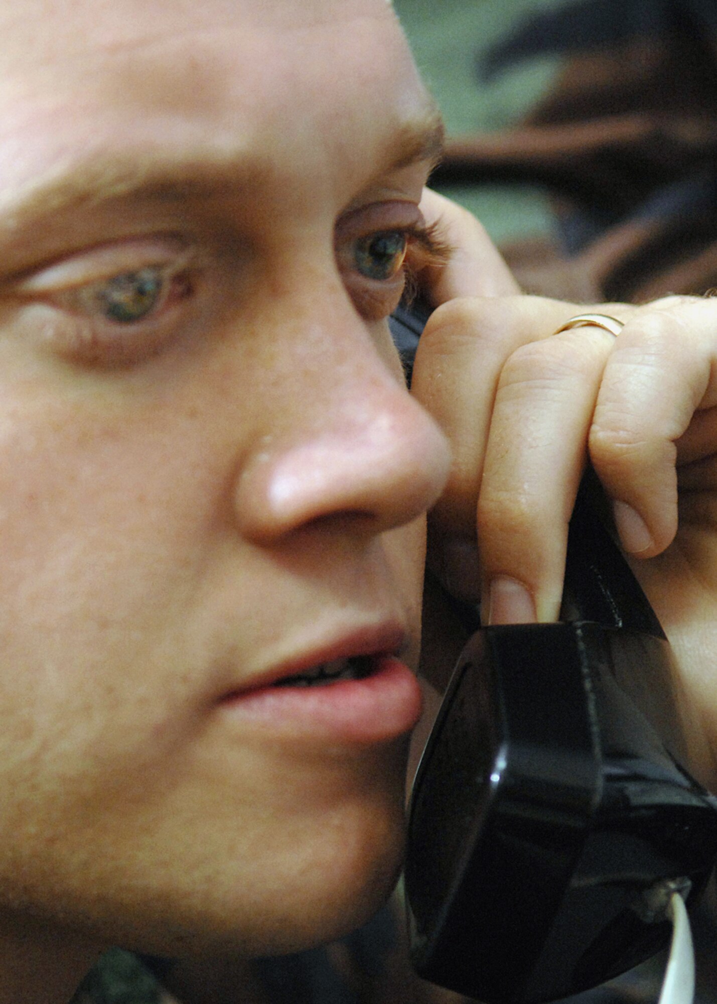 Andersen AFB, Guam -- Senior Airman Kyle Houseman, 36th Civil Engineer Squadron answers a call for an in flight emergency at Andersen's fire alarm communication center. Andersen's fire department trains every day to respond to such emergencies.
(U.S. Air Force Photo By Staff Sgt. Vanessa Valentine) 