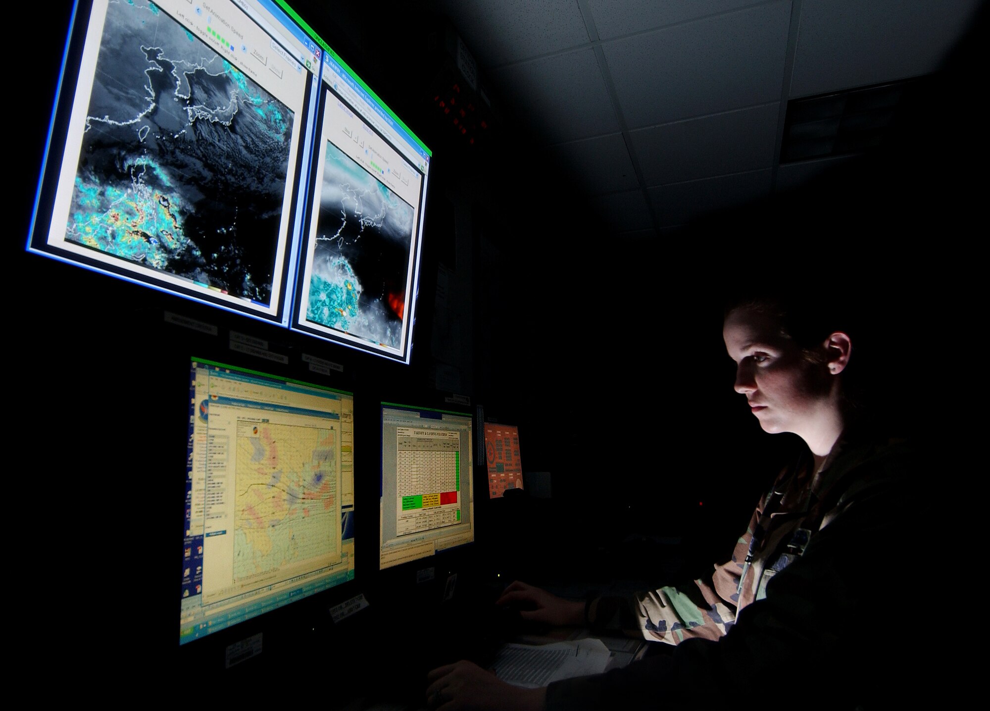 Senior Airman Brianna Reidel, 18th Operations Support Squadron weather forecaster, views a program used to analyze a weather model for predicting weather conditions in the Pacific region, Feb. 14. (U.S. Air Force photo/Tech. Sgt. Rey Ramon)

