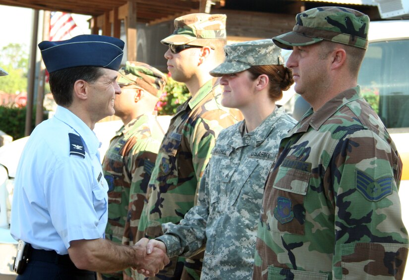 SOTO CANO AIR BASE, Honduras-- Air Force Col. Sean Murphy, U.S. SOUTHCOM command surgeon, shakes hands with the men and women carrying out the medical mission of Joint Task Force-Bravo. During a Feb.14 formation here, Colonel Murphy passed on his appreciation and gratitude for the work MEDEL personnel do in the region. (U.S. Air Force photo by Staff Sgt. Luis Santa)