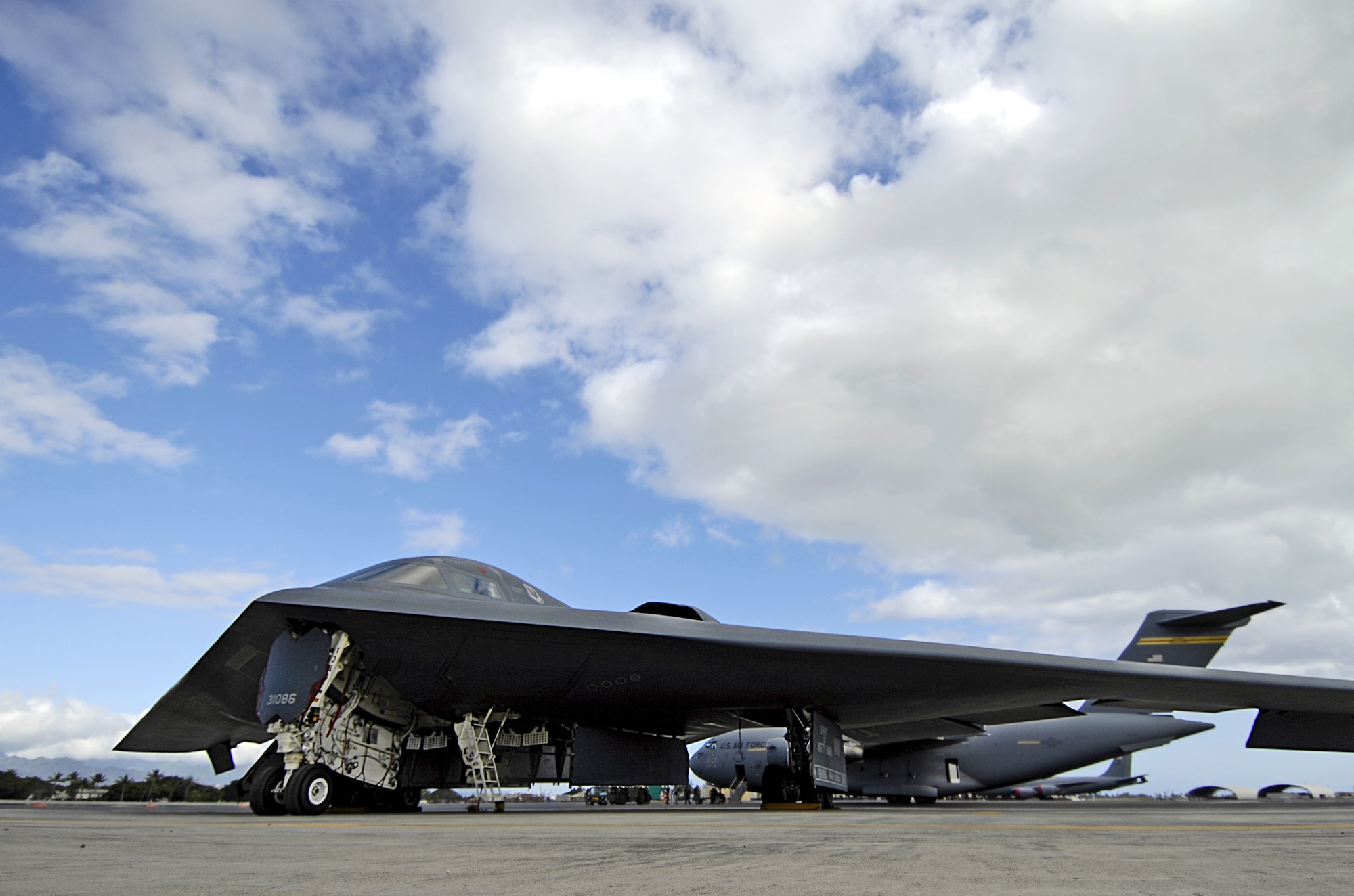 A B-2 Spirit stealth bomber sits at its parking spot on display Feb. 12, 2008 at Hickam Air Force Base, Hawaii. The B-2 on display is one of four bombers currently deployed to Andersen Air Force Base, Guam, as part of U.S. Pacific Command’s continuous bomber presence. The aircraft and approximately 280 aircrew and support personnel from the 509th Bomb Wing at Whiteman Air Force Base, Mo., have been in theater since Oct. 5. (U.S. Air Force photo/Tech. Sgt. Shane A. Cuomo)