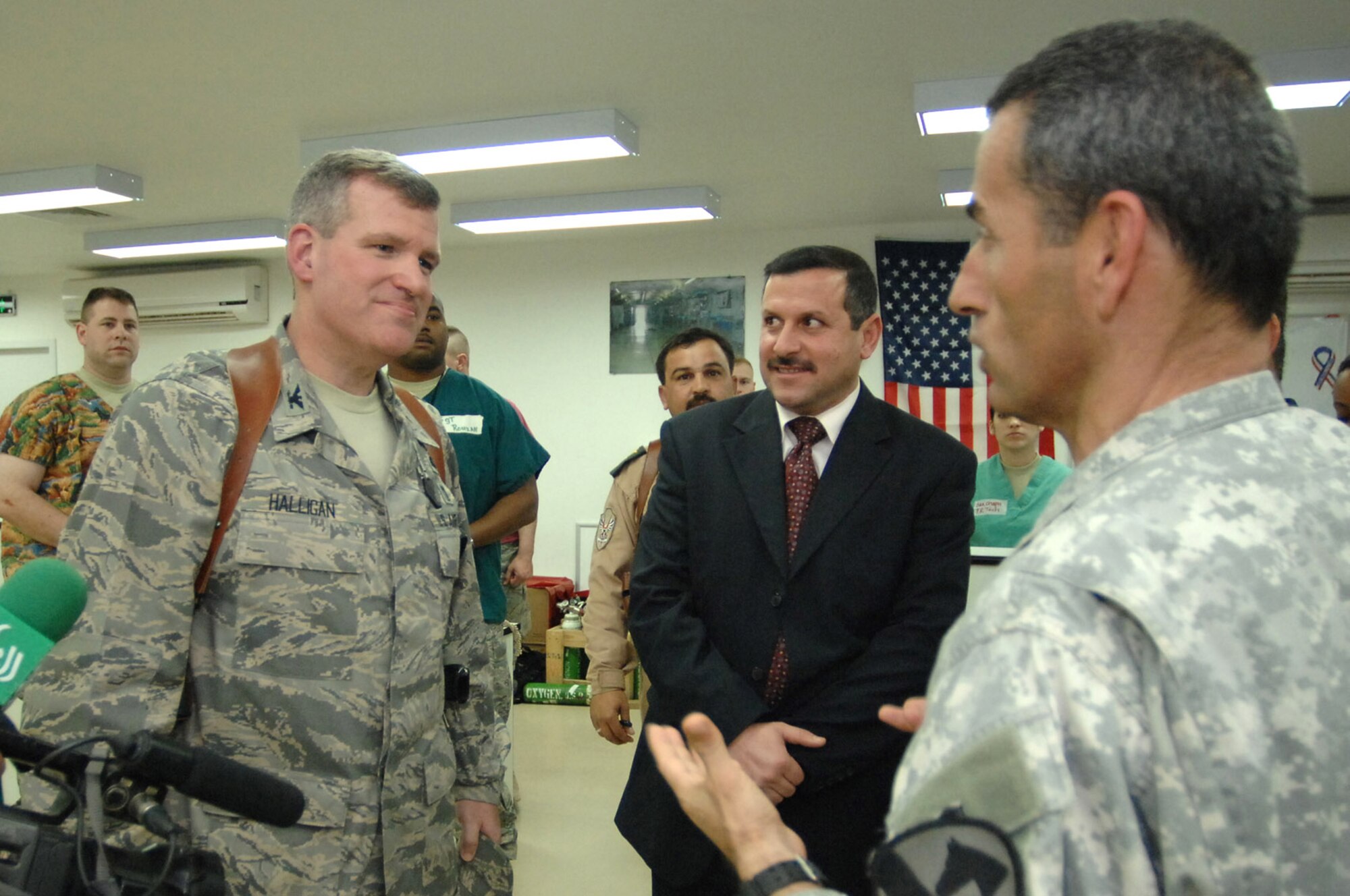 Col. Timothy Halligan speaks with city of Balad Mayor Amer Mrhown Al-Obedy (center) through a translator about the importance of training Iraqi doctors to eventually take the helm at the Air Force Theater Hospital Feb. 11 at Balad Air Base, Iraq. Colonel Halligan is the 332nd Expeditionary Medical Group deputy commander and deployed from Lackland Air Force Base, Texas. (U.S. Air Force photo/Senior Airman Julianne Showalter) 
