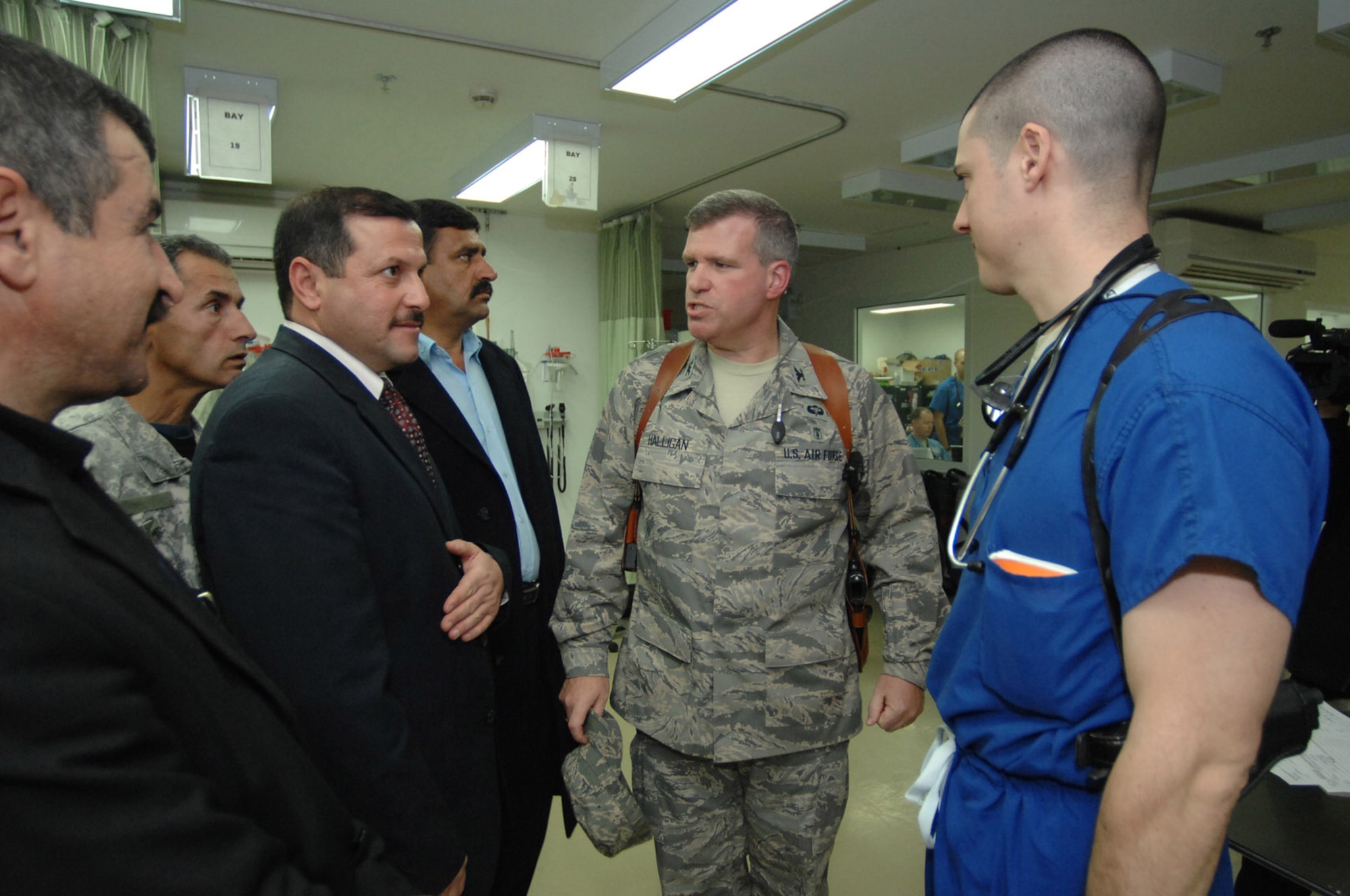 Leaders from the city of Balad, Iraq, meet with Maj. (Dr.) Paul DeFlorio (right)  Feb. 11 at Balad Air Base, Iraq. The doctor oversaw the medical treatment of 20 Iraqi civilians who were transported to the hospital the day before by Army Soldiers after a vehicle-borne improvised explosive device was detonated near the city of Balad. The Iraqi leaders were taken to the bedsides of their injured countrymen by Col. Timothy Halligan, the 332nd Expeditionary Medical Group deputy commander (center). Major DeFlorio is the Air Force Theater Hospital emergency department officer in charge. Major DeFlorio and Colonel Halligan are deployed from Lackland Air Force Base, Texas. (U.S. Air Force photo/Senior Airman Julianne Showalter) 
