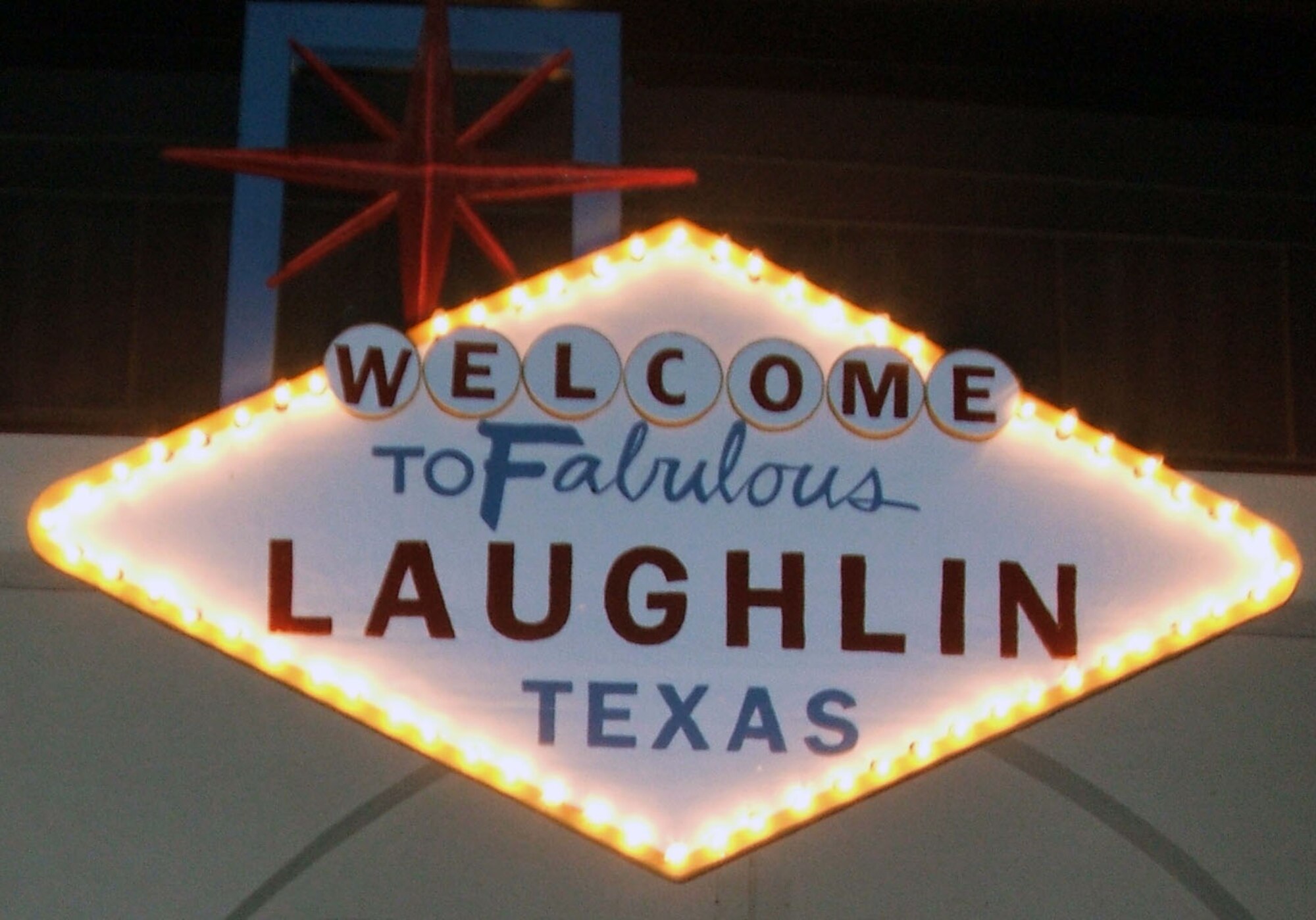 LAUGHLIN AIR FORCE BASE, Texas – The entrance of the Annual Officer’s Spouses Clubs Auction at Feb. 9 at Club XL, was decorated to help resemble Las Vegas as much as possible with a replica sign fro Las Vegas. Viva Vegas was the name of the themed night with pretend gambling, karaoke and a Chapel of Love. (U.S. Air Force photo by Airman 1st Class Sara Csurilla)