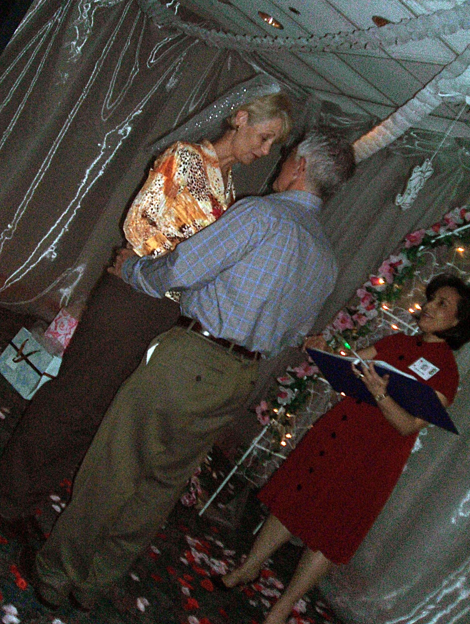 LAUGHLIN AIR FORCE BASE, Texas – A couple renews their vowels at the Chapel of Love during the annual Officer’s Spouses Clubs auction at Feb. 9 at Club XL. Viva Vegas was the name of the themed night with pretend gambling, karaoke and a Chapel of Love. (U.S. Air Force photo by Airman 1st Class Sara Csurilla)