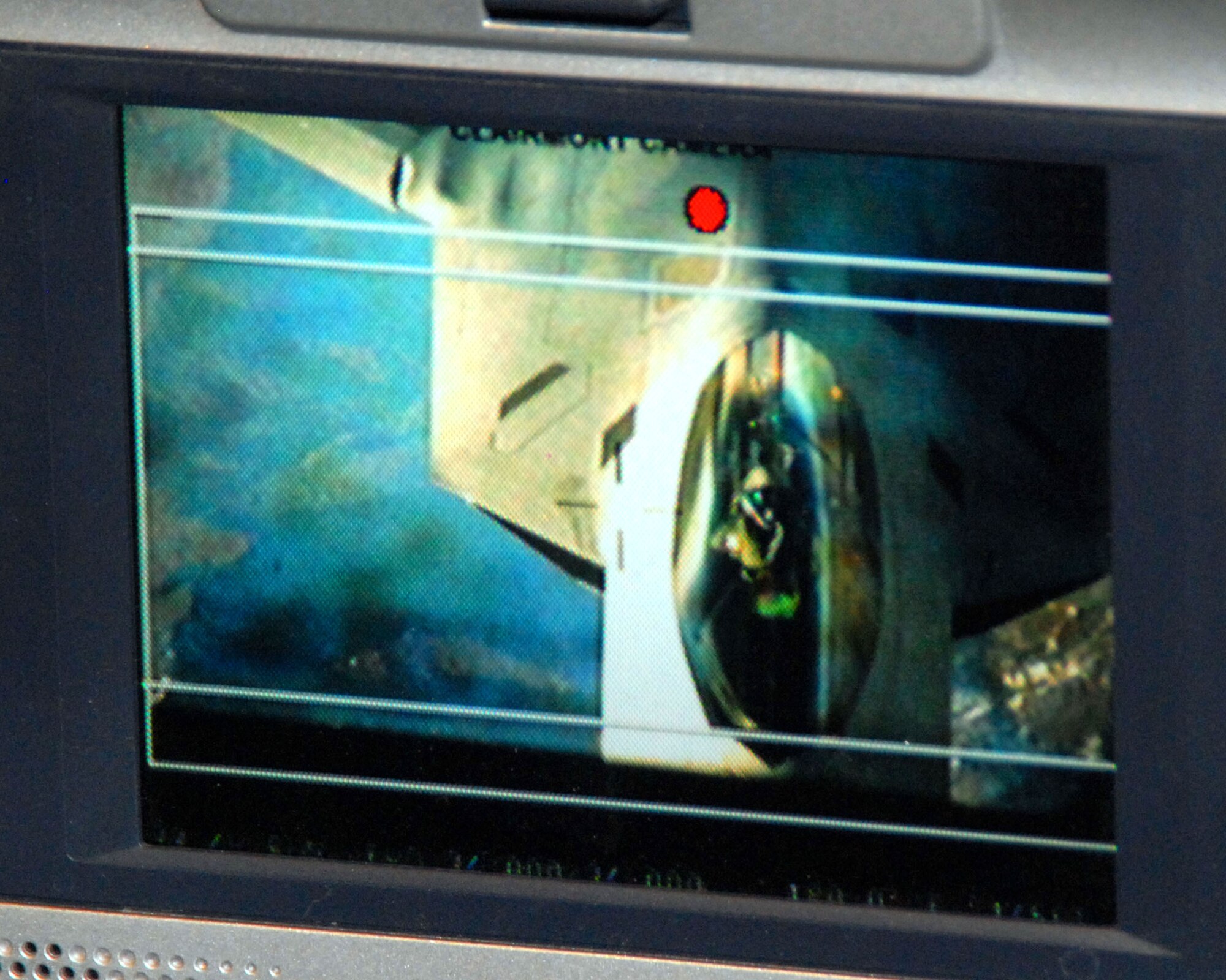 As seen through a monitor on board a KC-10 Extender, an F-22 Raptor is filmed pulling up behind a KC-10 for an aerial refueling Feb. 7 above Edwards Air Force Base, Calif. (U.S. Air Force photo/Master Sgt. Eric M. Grill) 
