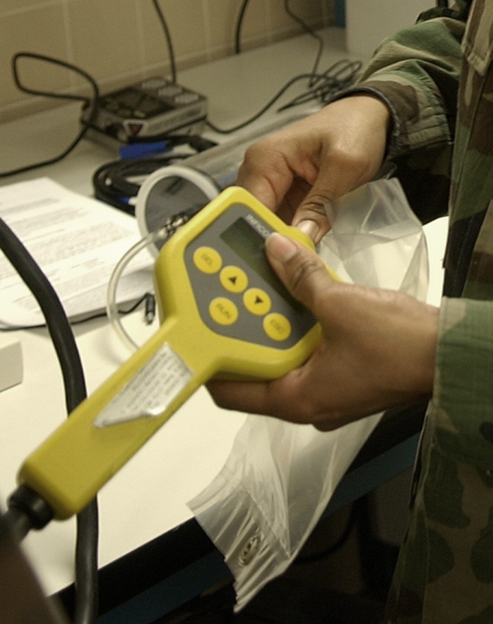 CANNON AIR FORCE BASE, N.M. -- Lt. Col. Ivette O'Brien, 27th Special Operation Wing Inspector General, uses a chemical identification system to test an air sample at the 27th Special Operations Aeromedical Dental Squadron, Bioenvironmental Engineering Flight, to maintain her proficiency. Colonel O'Brien was the commander of the flight when she received the Air Force Field-Grade Base Bioenvironmental Engineer of the Year award for her work in fiscal year 2007. (U.S. Air Force photo/Senior Airman Thomas Trower)