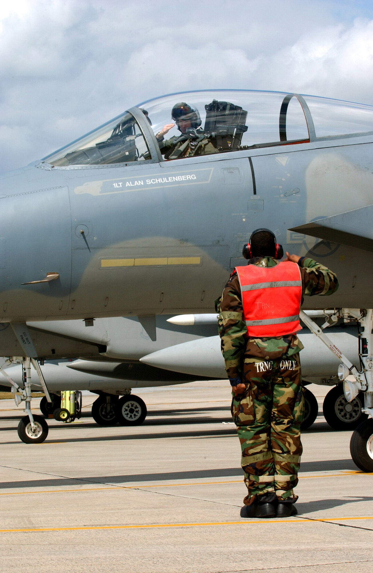 Senior Airman Christopher Smith, 18th Aircraft Maintenance Squadron, salutes 1st Lt. Alan Schulenberg, 44th Fighter Squadron, after receiving his final inspection during local operational readiness exercise Beverly High 08-4 at Kadena Air Base, Japan, Feb. 14, 2008. The 18th Wing conducted the exercise from Feb. 10 to 15 to test Airmen's ability to respond in contingency situations. 
(U.S. Air Force photo/Senior Airman Jeremy McGuffin) 
