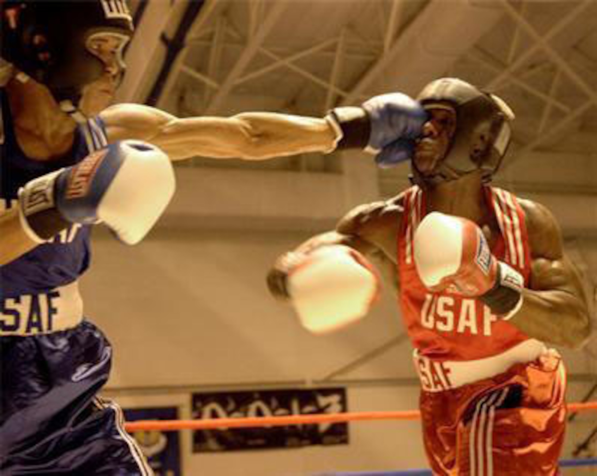 Staff Sgt. Thomas Jacobs, left, demonstrates his left hook in a boxing match at the Air Force training camp. Sergeant Jacobs earned a spot on the Air Force boxing team and competed in the Armed Forces championship. Courtesy photo