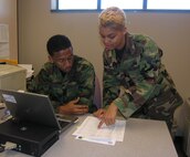 SEYMOUR JOHNSON AIR FORCE BASE, N.C. --  Staff Sgt. Cherie Rayford helps Capt. Craig Stokes with some Military Equal Opportunity paperwork. U.S. Air Force photo/Ms. Donna Lea