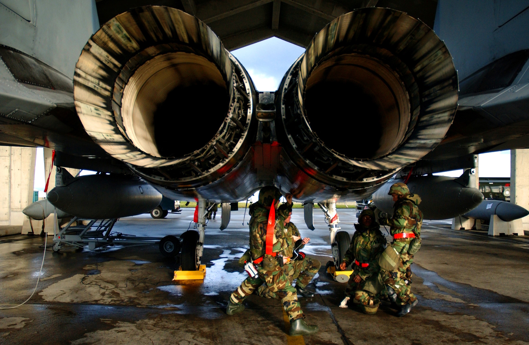 Airmen from the 18th Aircraft Maintenance Squadron perform final checks for fuel leaks after an engine swap during local operational readiness exercise Beverly High 08-4 at Kadena Air Base, Japan, Feb. 14, 2008. The 18th Wing conducted the exercise from Feb. 10 to 15 to test Airmen's ability to respond in contingency situations. 
(U.S. Air Force photo/Senior Airman Jerermy McGuffin) 