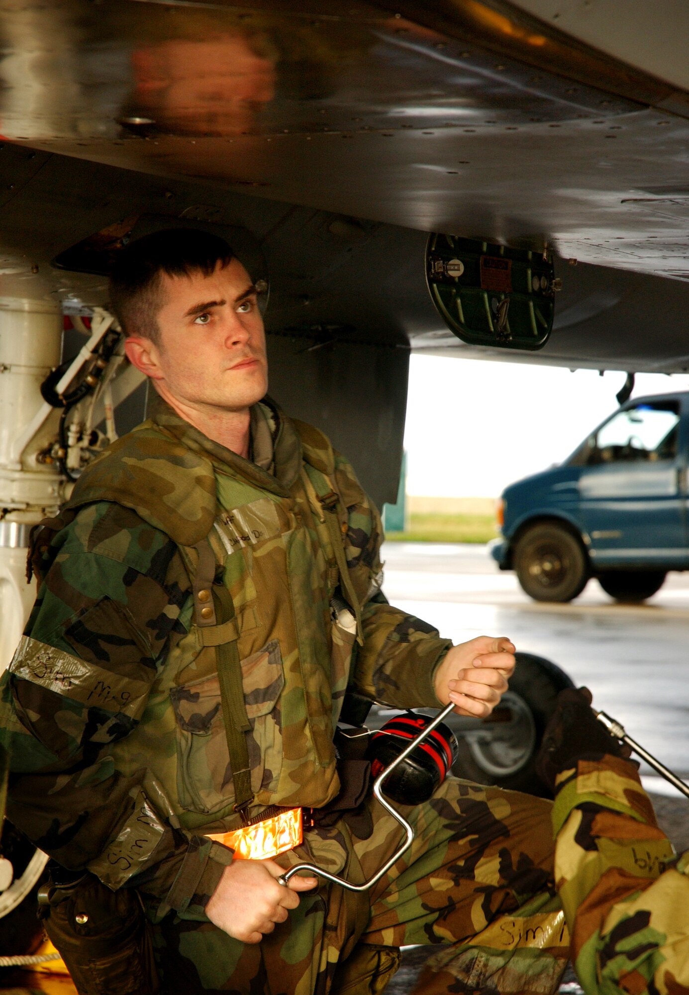 Senior Airman Clifford Daniels, 18th Aircraft Maintenance Squadron assistant dedicated crew chief, checks for any loose bolts under an F-15 Eagle after a right side engine swap during local operational readiness exercise Beverly High 08-4 at Kadena Air Base, Japan, Feb. 14, 2008. The 18th Wing conducted the exercise from Feb. 10 to 15 to test Airmen's ability to respond in contingency situations. 
(U.S. Air Force photo/Senior Airman Jeremy McGuffin) 