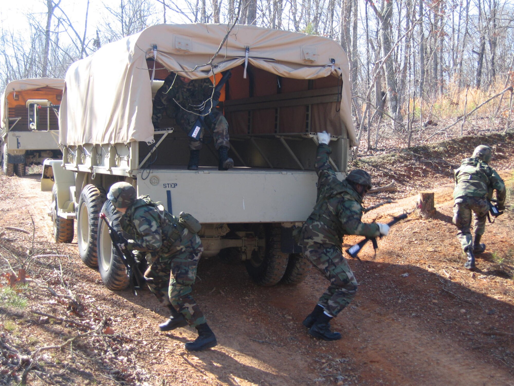 SEYMOUR JOHNSON AIR FORCE BASE, N.C. -- Members of the 916th Civil Engineer Squadron quickly exit a truck during combat training in New London, N.C. in mid-February. The reservists trained on everything from combat convoy training to self-aid and buddy care during the four-day exercise.
