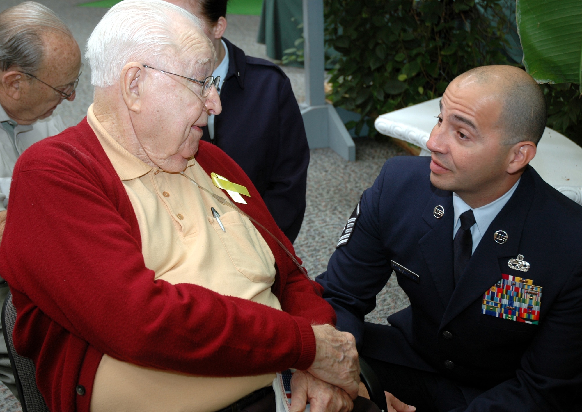 Master Sgt. James Pons-Santiago, 46th Aircraft Maintenance Squadron, speaks with Henry Christensen during a Valentines for Vets visit to the Westwood Retirement Resort Feb. 14. More than 50 Eglin Airmen visited local veterans at four retirement facilities on Valentines Day. (Photo by Tech. Sgt. Brian Jones)