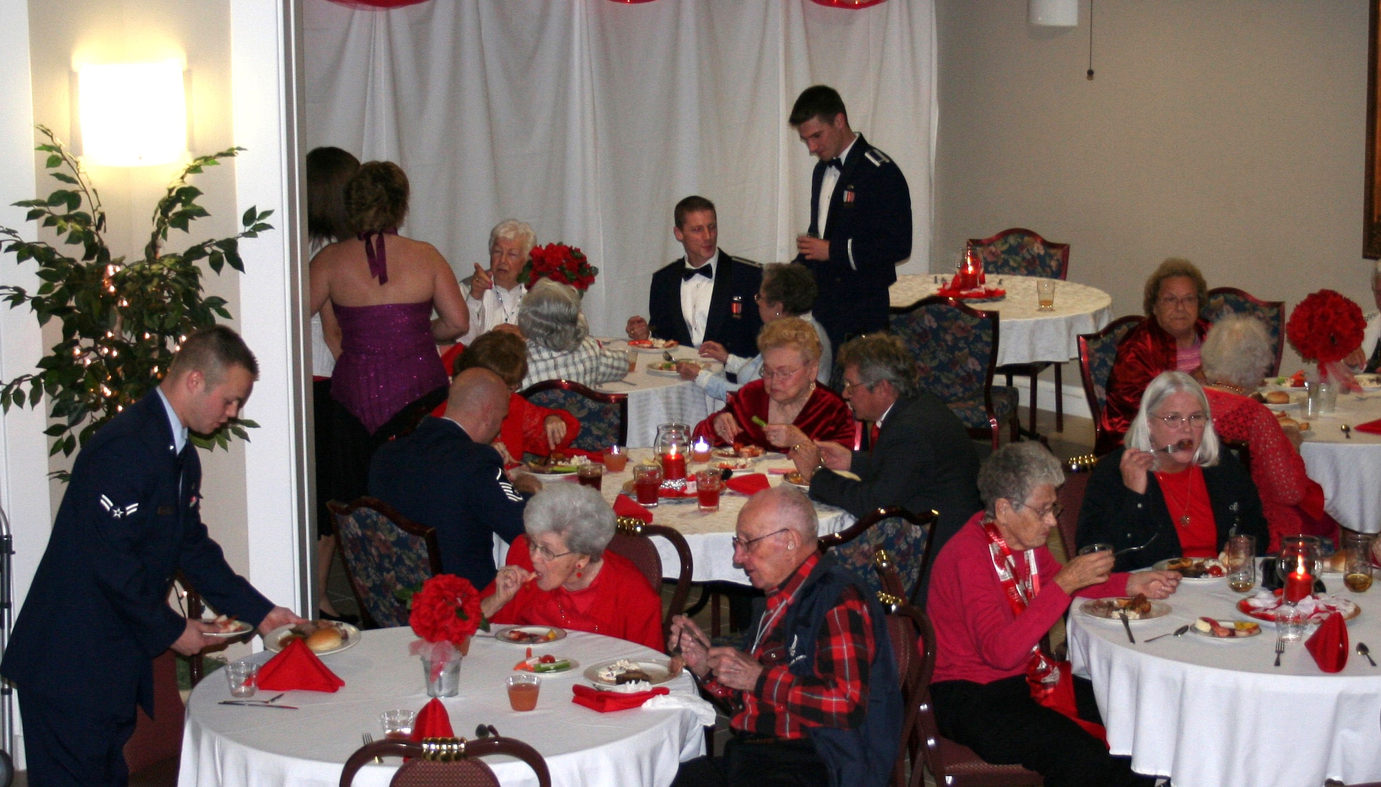 More than thirty Airmen from nearby Hurlburt Field and Eglin Air Force Base joined residents at the Air Force Enlisted Village's Hawthorn House in Shalimar, Fla., Feb. 9 for their Valentine's Day Ball.  Hawthorn House is the AFEV's assisted living residence.  The ball included dinner and a dance.  (U.S. Air Force photo/Jodi L. Jordan)