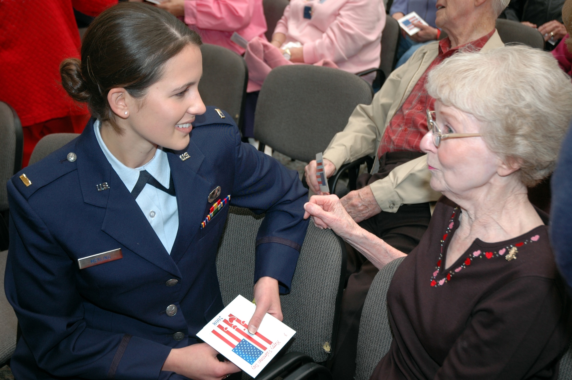 Second Lt. Christine Meyling, 96th Air Base Wing executive officer, chats with Betty Heider during a Valentines for Vets visit to the Westwood Retirement Resort Feb. 14. More than 50 Eglin Airmen visited local veterans at four retirement facilities on Valentines Day. (Photo by Tech. Sgt. Brian Jones)