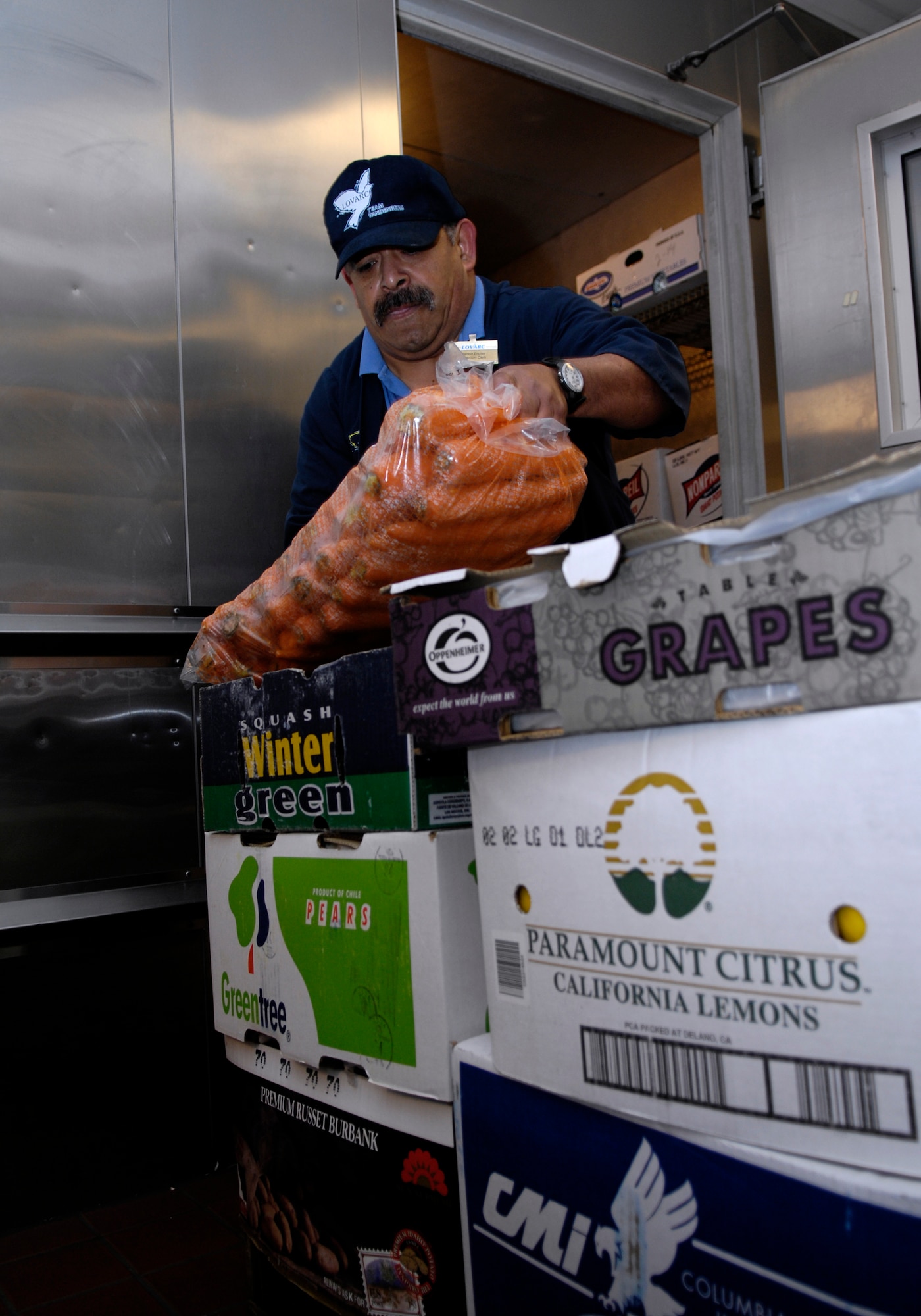VANDENBERG AIR FORCE BASE, Calif. -- Ramon Enciso, a LOVARC employee, stocks the freezer at Breakers Dining Facility on Feb. 14. The John L. Hennessy Award team will visit here Feb. 22-25. The Hennessy trophy is the highest Air Force award given for excellence in food service. (U.S. Air Force photo by Airman 1st Class Jonathan Olds)
