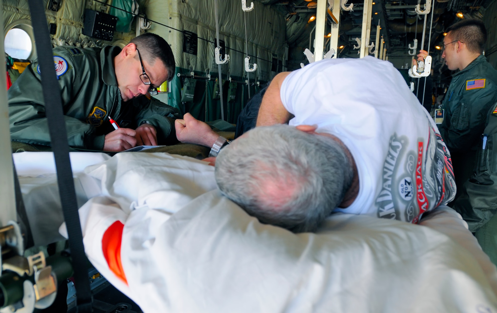 SCOTT AIR FORCE BASE, Ill. -- Capt. Kirk Smith, 375th Aeromedical Evacuation Squadron flight nurse, records medication provided to a patient Feb. 9 at Scott AFB, Ill. The 375th Airlift Wing located at Scott is one of three Aeromedical Staging Facility distribution hubs in the continental United States that is responsible for transporting patients to their home bases or other specialized hospitals. (U.S. Air Force photo/Master Sgt. Maurice Hessel)