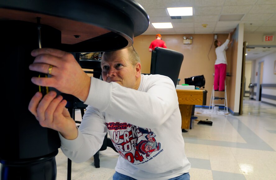 SCOTT AIR FORCE BASE, Ill. -- Ken Wavering, Science Applications International Corporation defense contractor, assembles a table donated by National Defense Transportation Association in the 375th Aeromedical Staging Facility recreation room Feb. 9 at Scott AFB, Ill. Organizations throughout Joint Total Force Scott have sponsored ASF rooms and provided patients with all the comforts of home during their stay. (U.S. Air Force photo/Master Sgt. Maurice Hessel)