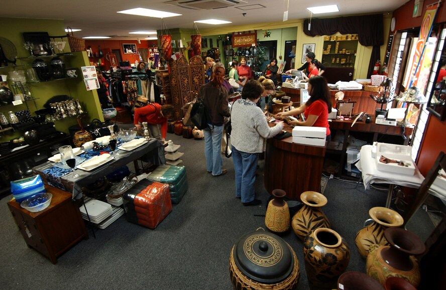 Military members and their families shop at the Gift Corner located at Kadena Air Base, Japan, Feb. 1. The gift shop sells merchandise from many countries and is operated by the Kadena Officers' Spouse's Club which donates the profits to a variety of local charities and scholarship programs.  (U.S. Air Force photo/Tech. Sgt. Rey Ramon)