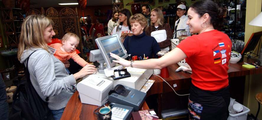 Kim Freese, a family member from nearby Camp Hansen, does some quick shopping Feb. 1 at the Gift Corner located at Kadena Air Base, Japan. The gift shop is operated by the Kadena Officers' Spouse's Club which donates the profits to a variety of local charities and scholarship programs.  (U.S. Air Force photo/Tech. Sgt. Rey Ramon)
