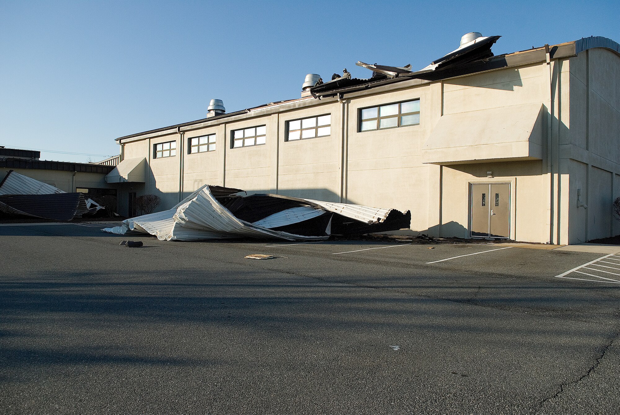 Approximately 12,000 square feet of metal roof was damaged at the Dover Air Force Base Fitness Center Feb. 10. High winds, with gusts reaching 51 knots, on Dover Air Force Base Feb. 10, caused the roofing to pull from the structure. (U.S. Air Force photo/Roland Balik)