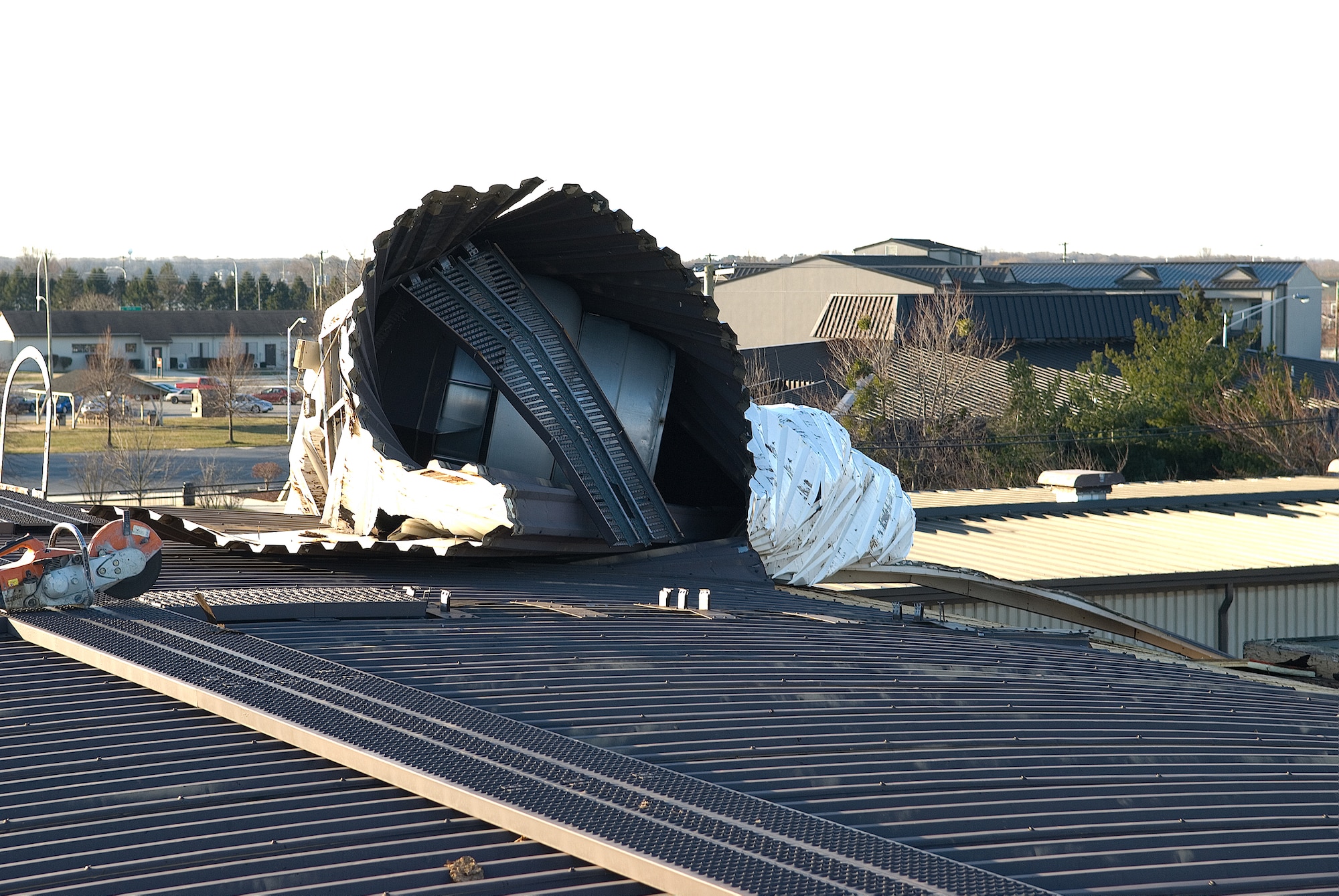 The exhaust ventilator (pictured) and approximately 12,000 square feet of metal roof was damaged at the Dover Air Force Base Fitness Center Feb. 10. High winds, with gusts reaching 51 knots, caused the metal roofing at the base Fitness Center to pull from the structure and wrap around the exhaust ventilator. (U.S. Air Force photo/Roland Balik)