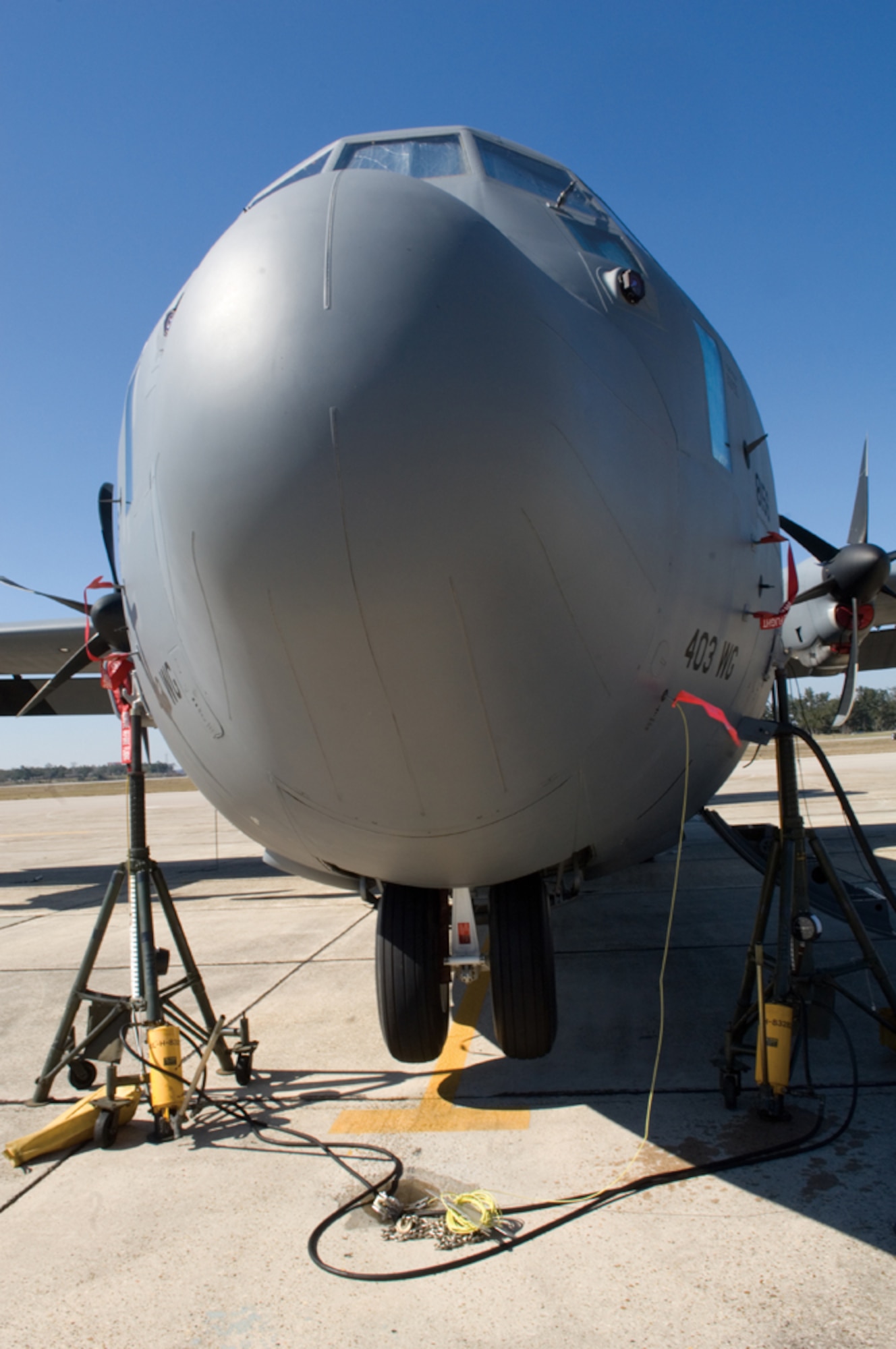 On the rack, Aircraft 8156, assigned to the 815th Airlift Squadron's Flying Jennies, is supported by jack stands while maintainers from the 403rd Maintenance Squdrons's Aero Repair Shop conduct look after one of the 18 C-130J Super Hercules aircraft in the 403rd Wing fleet. This airframe is a C-130J-30 which is a "stretched" version of the J-model that has an extra 15 feet in length allowing the Jennies to carry more cargo. (U.S. Air Force Photo/Tech. Sgt. James B. Pritchett)