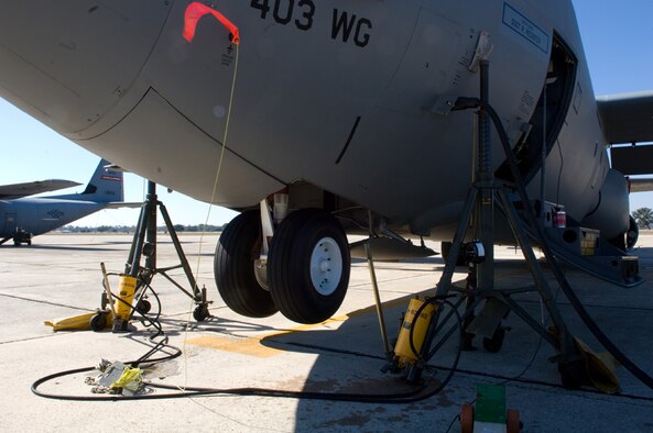 On the rack, Aircraft 8156, assigned to the 815th Airlift Squadron's Flying Jennies, is supported by jack stands while maintainers from the 403rd Maintenance Squdrons's Aero Repair Shop conduct look after one of the 18 C-130J Super Hercules aircraft in the 403rd Wing fleet. This airframe is a C-130J-30 which is a "stretched" version of the J-model that has an extra 15 feet in length allowing the Jennies to carry more cargo. (U.S. Air Force Photo/Tech. Sgt. James B. Pritchett)