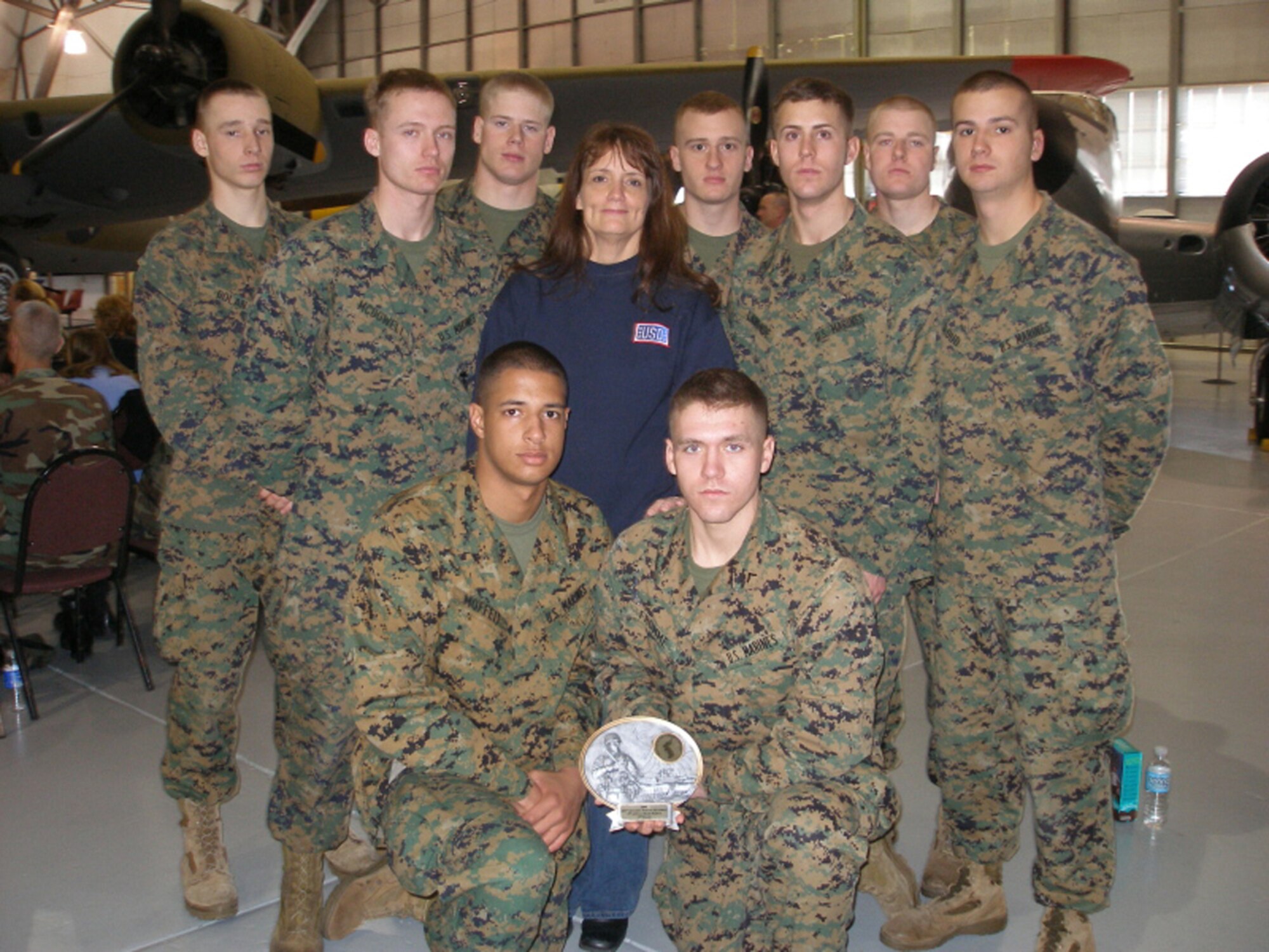(Center) Joan M. Cote, USO Delaware director, sponsored two teams of Marines from Marine Corps Barracks, Washington, D.C., to compete in the 9th Annual Ruck March here Feb. 2. Ms. Cote’s mother and father were both Marines and served in the Korean War. The ruck march is held here at Dover Air Force Base every year to commemorate veterans of the Korean War Battle of Chosin Reservoir. (Courtesy photo)